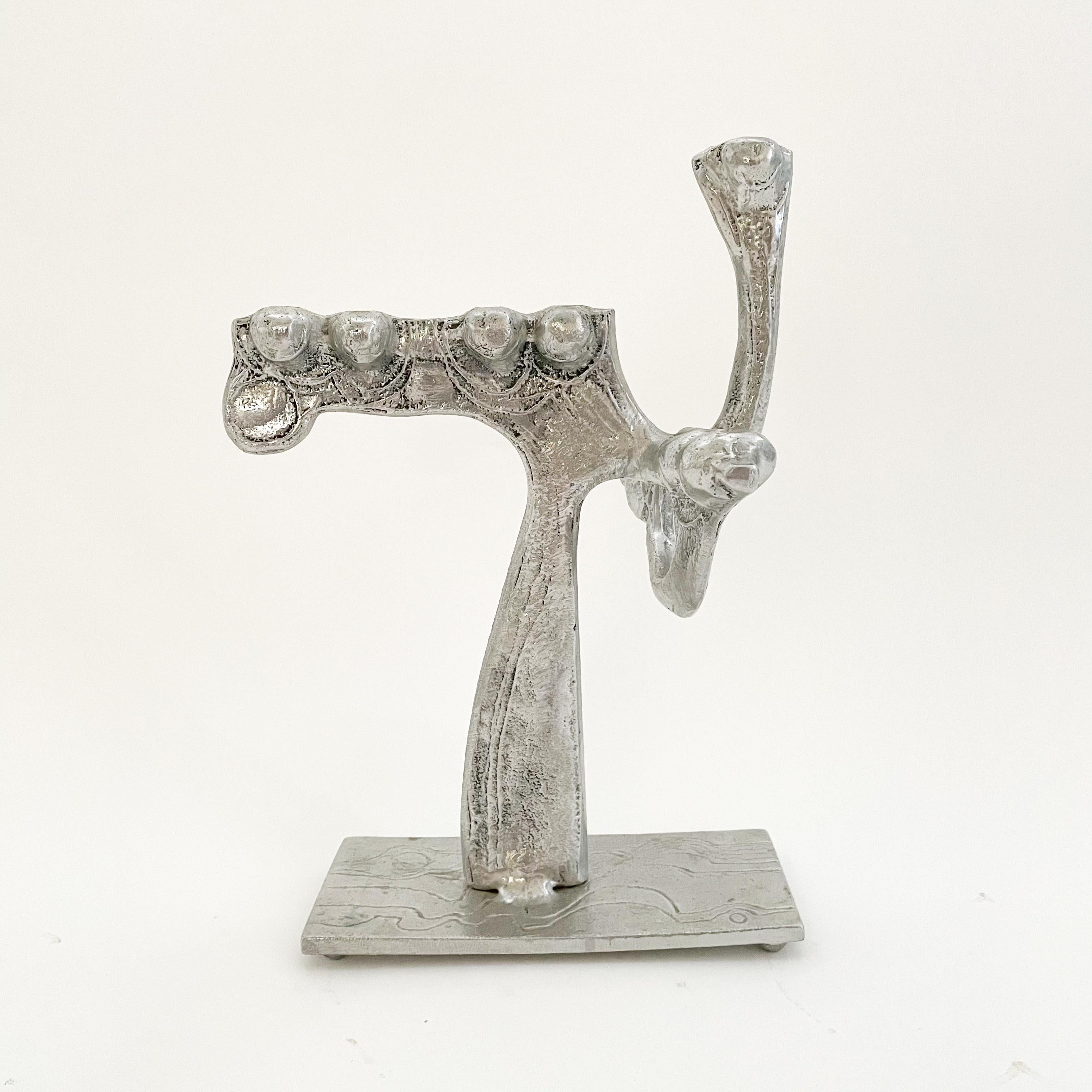 Brutalist aluminum menorah designed by artist Don Drumm's 