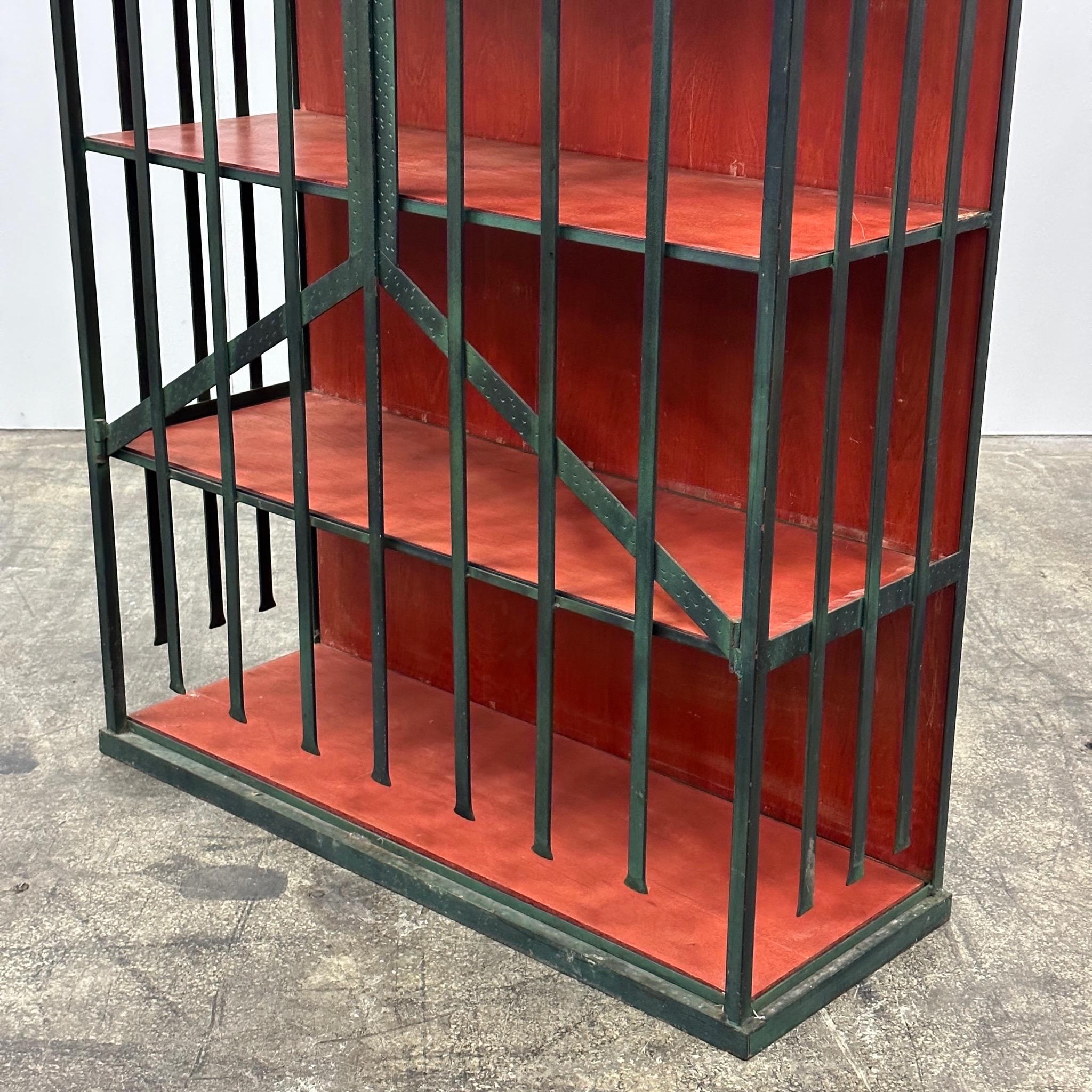 c. 1990s. Metal construction with plywood shelving and backing, can be customized to different color wood if desired. Latch in front to keep closed. 