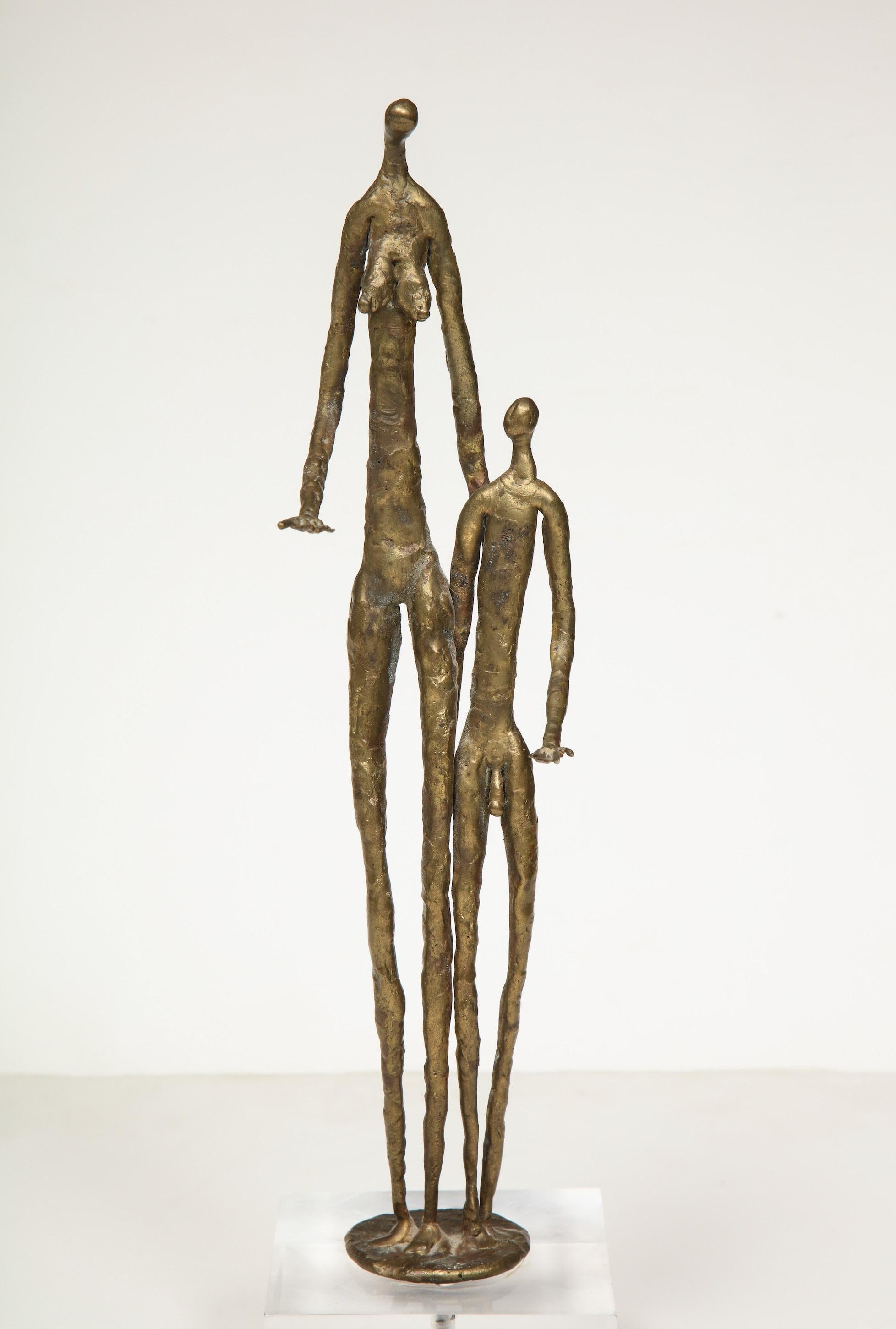 Brutalist metal figurative couple sculpture.