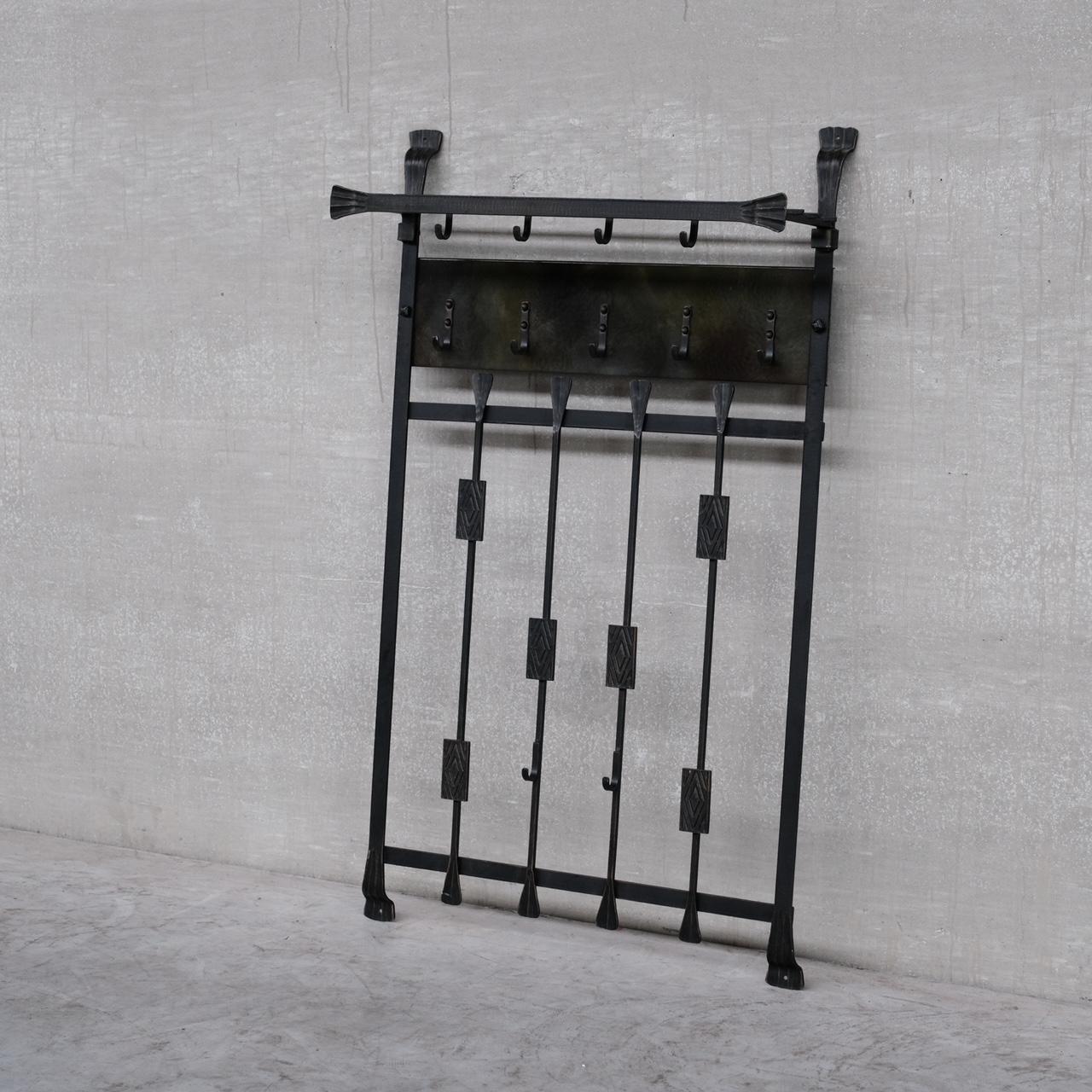 A metal brutalist coat rack wall unit. 

Belgium, c1970s. 

Unusual green tint finish to part of the middle metal bar at the top. 

Good condition, functional and stylish.

Location: Belgium Gallery. 

Dimensions: 81 W x 136 H x 7 D in cm.