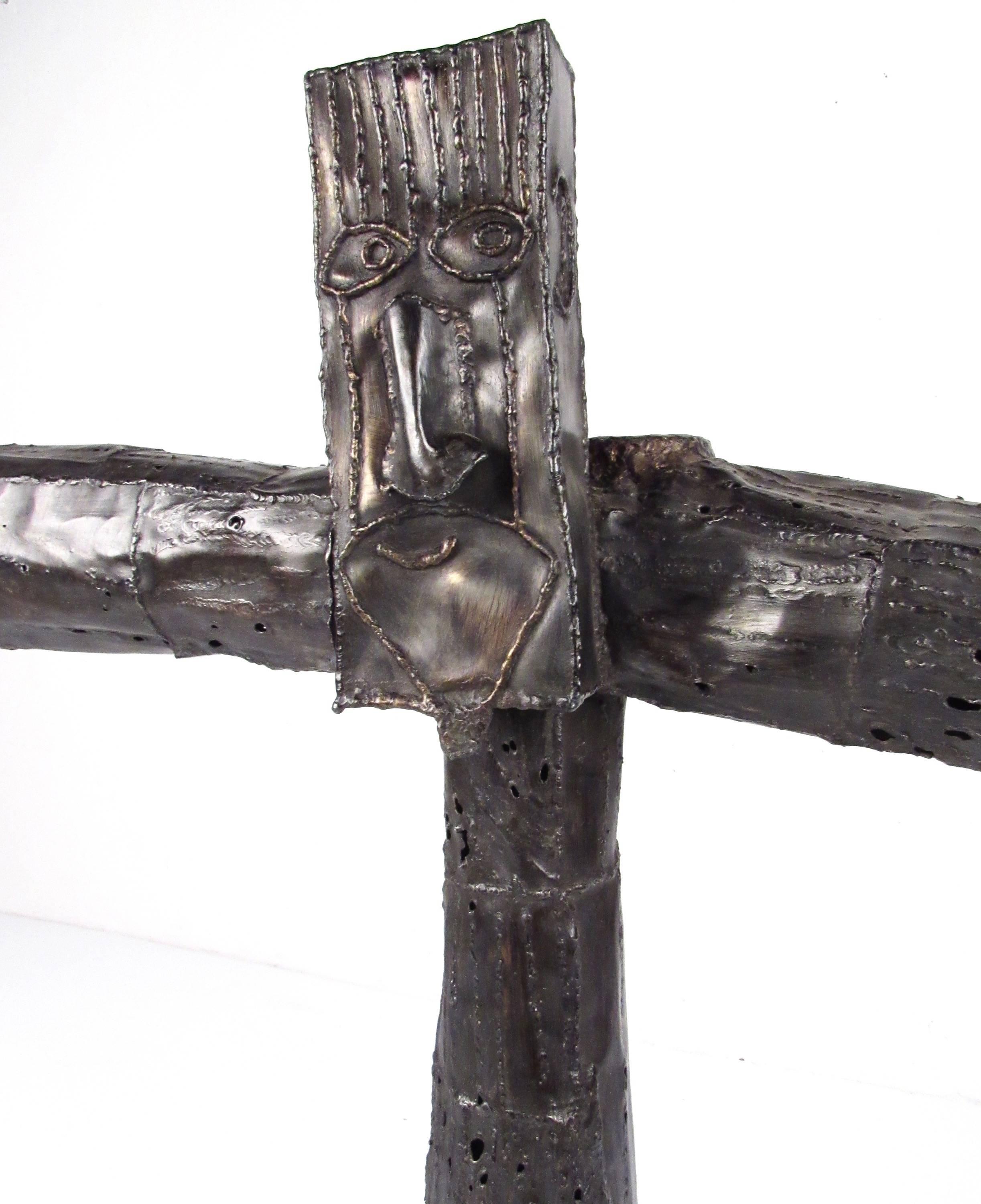 This stylish cross shaped sculpture features uniquely fantastical detail in a brutalist modern presentation. Eye-catching table sculpture from hammered or textured metal, signed by artist Jay Kaplan. Please confirm item location (NY or NJ).