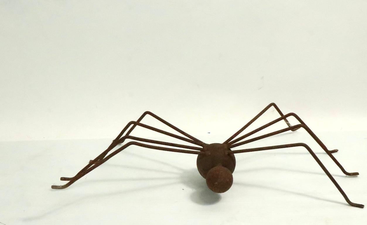 Brutalist spider sculpture, in rust surface. Handmade and probably unique, metal sculpture suitable for indoor or outdoor display.
