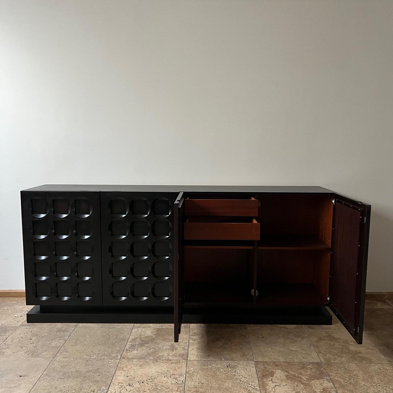 A geometric graphic sideboard or credenza.

Belgium, circa 1970s.

Often attributed to De Coene.

Four doors with shelving and drawers. Ideal TV unit.

We have had it blackened/ebonised for a more contemporary feel.

Good vintage