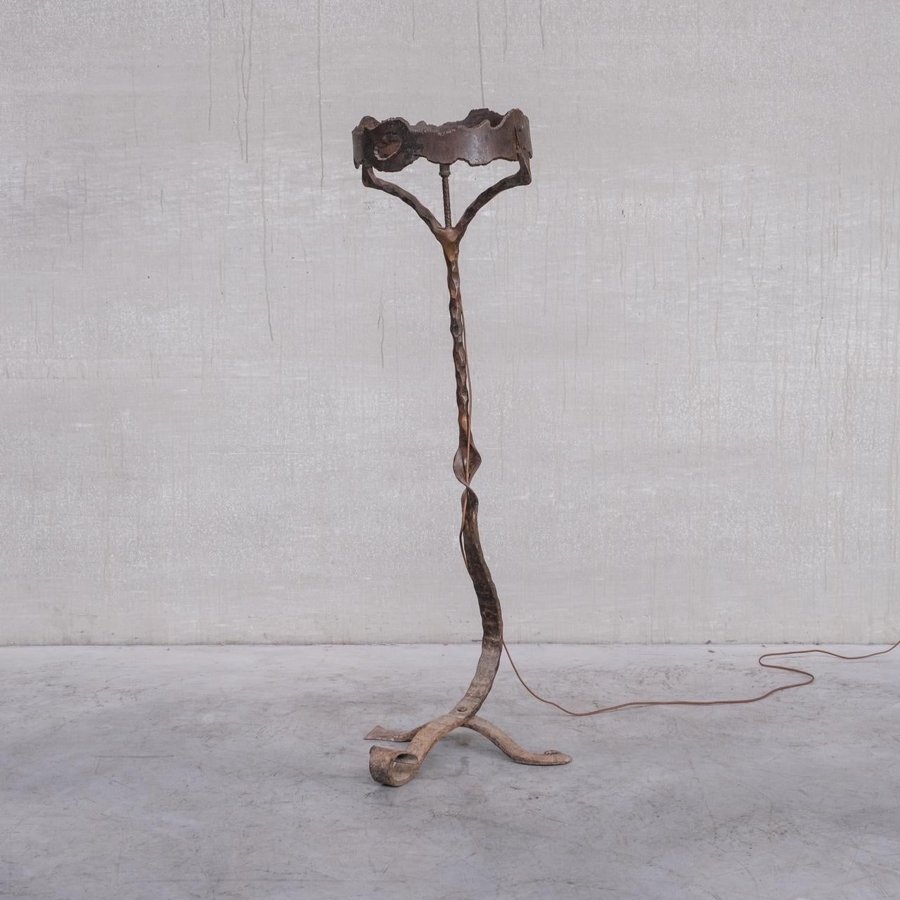 A tall floor lamp in bent and forged iron. 

France, c1950s. 

One of the best floor lamps we have had the fortune to source. 

Brutalist style. 

Easily could have a custom shade made if one wants a hidden bulb. We have skilled shade makers