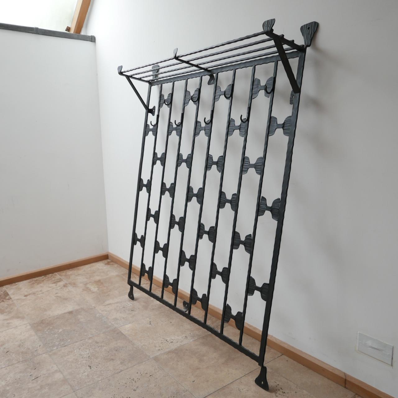 A large and scarce Brutalist style coat rack and shelving unit. 

Well formed and crafted out of iron. 

Belgium, c1970s. 

Very good condition. 

Dimensions: 130 W x 161 H x 27 D in cm. 

Delivery: POA.

 