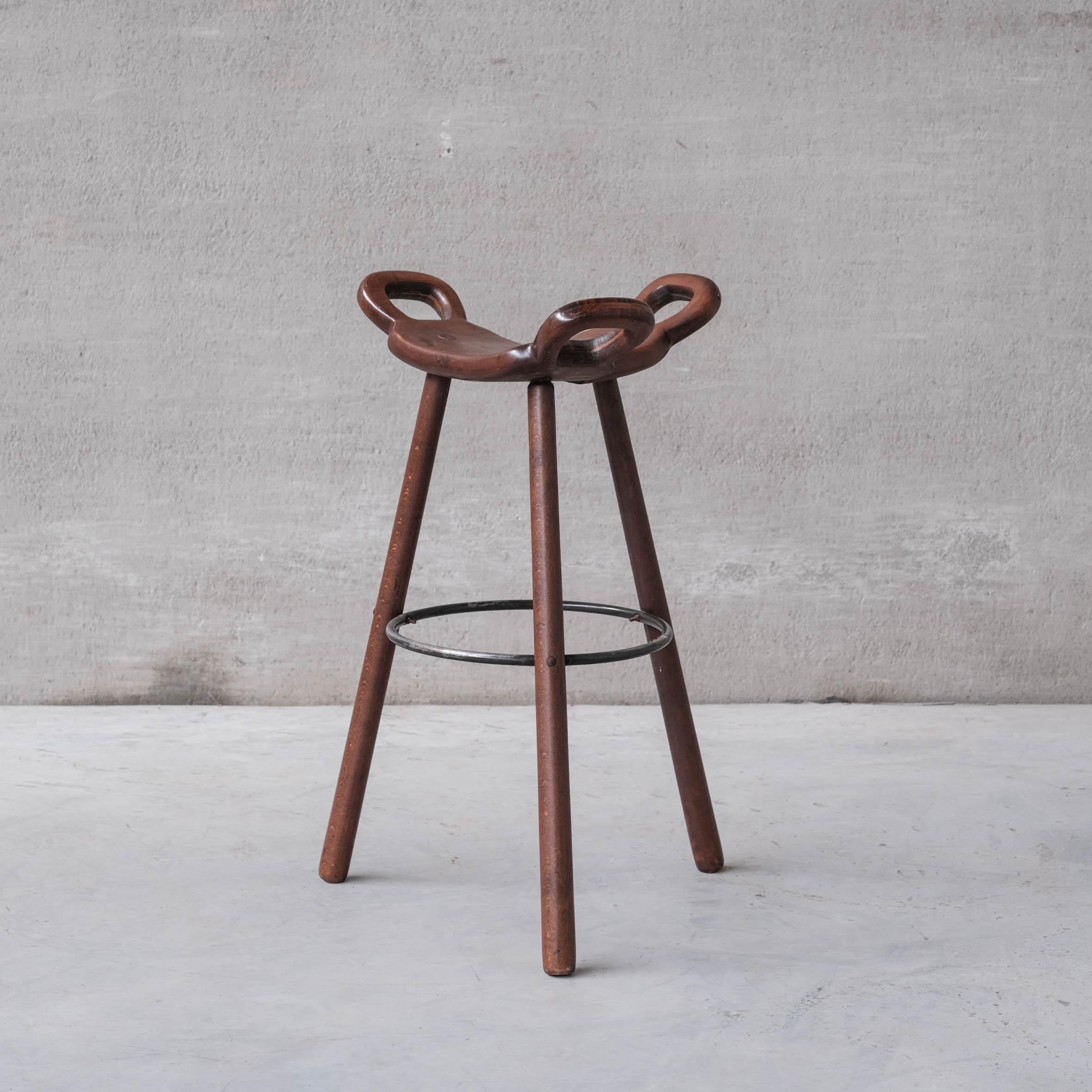 A set of up to eight mid-century wooden and iron bar stools. 

Spain, c1970s. 

Likely by Confonorm, Spain. Often attributed to Sergio Rodrigues and Carl Malmsten.

Good vintage condition. Some scuffs and wear commensurate with age. 

Priced