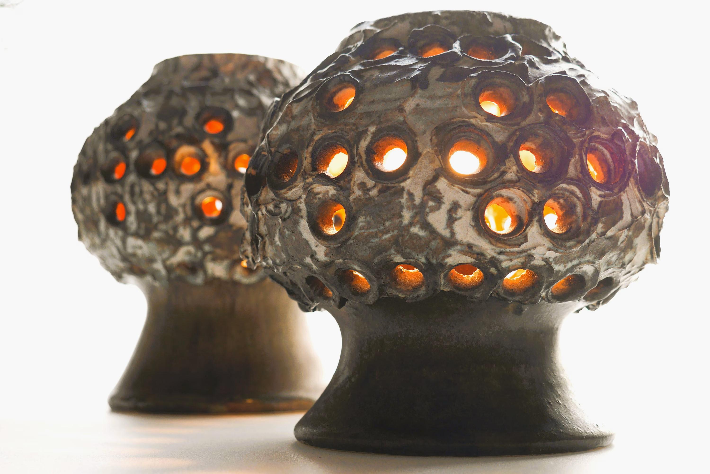 A fantastic pair of very special ceramic lamps, these table lamps are really cool and very much gives a 70s feeling. The texture is rough with several small holes, which gives a very nice light, the colour is a pale chocolate brown, with some white