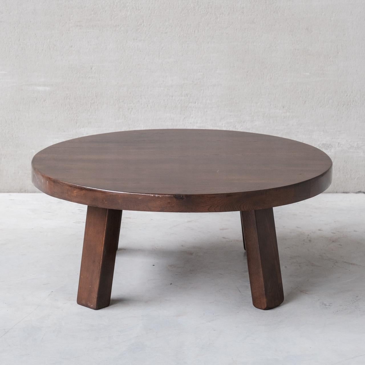 A circular brutalist coffee table. 

Belgium, c1970s. 

Simple clean lines, circular top over four legs. 

Good condition, some scuffs and wear commensurate with age. 

Location: Belgium Gallery.

Dimensions: 46 H x 110 Diameter in cm.