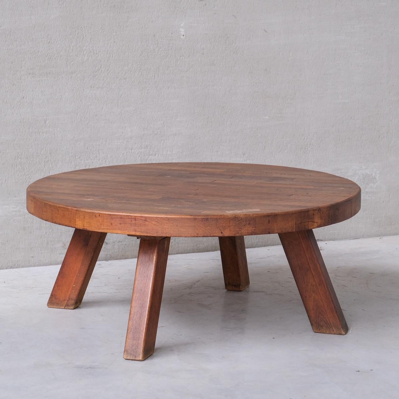 A large oak coffee table.

Belgium, c1970s.

Chunky top, raised over four legs.

Good vintage condition, some scuffs and wear commensurate with age.

Location: Belgium Gallery.

Dimensions: 49 H x 115 Diameter in cm.

Delivery: POA

We can ship