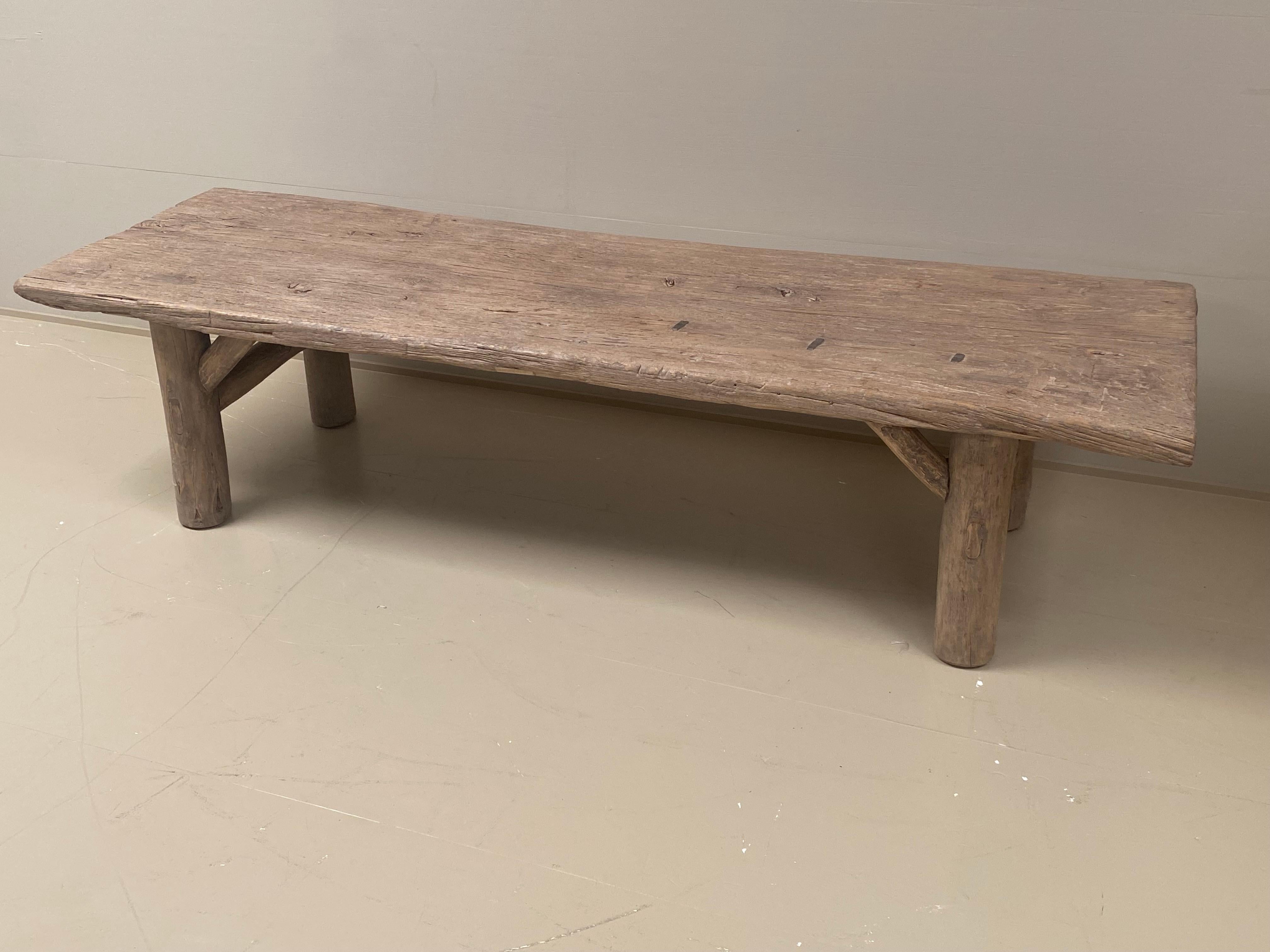 Brutalist French coffeetable in a bleached elm wood,1960 ties,
the wood has a warm and worn finish and a great color,
the top has also a few metal old restorations,
the base is made of round wooden legs and stretchers,
beautiful piece of