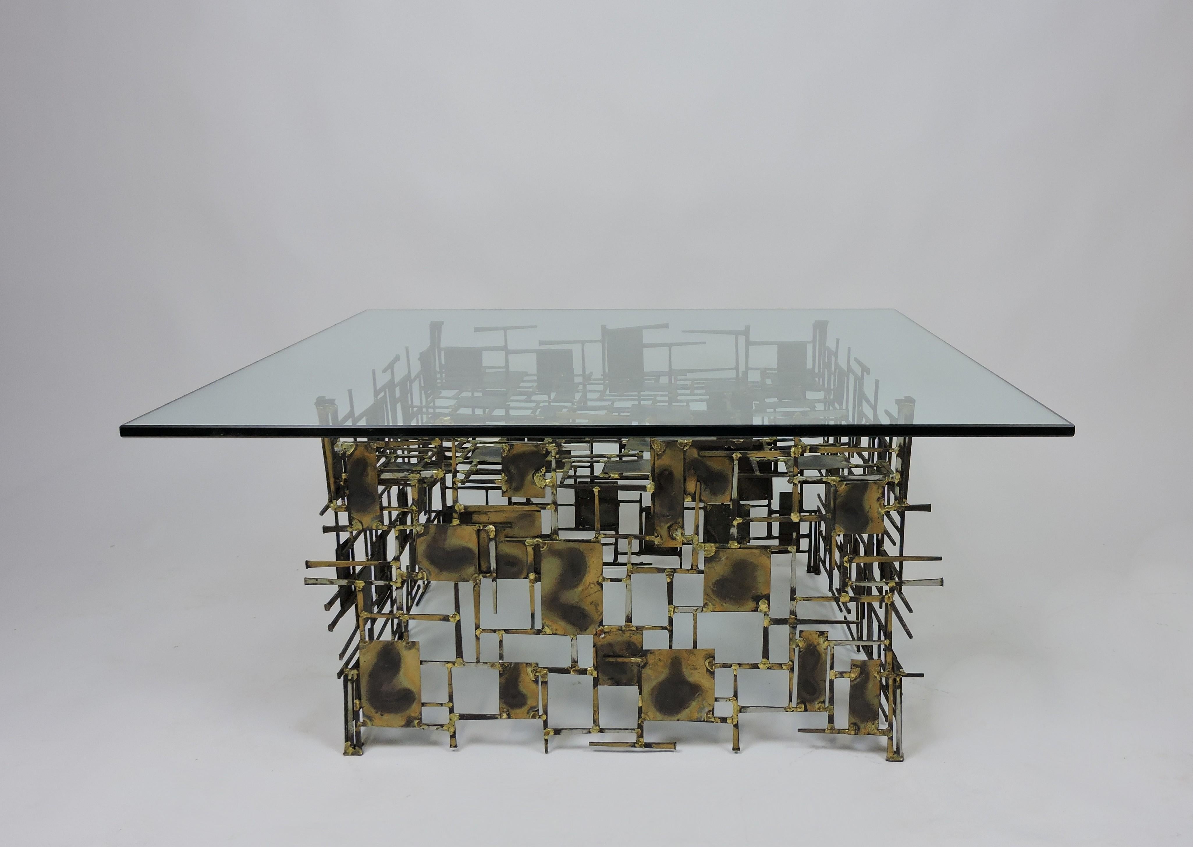 Very cool Brutalist style coffee table by Marc Creates from the 1960s/70s. This intricate and well constructed table is made up of small metal sheets and nails which are held together with hundreds of welds. The metal sheets have a heat applied