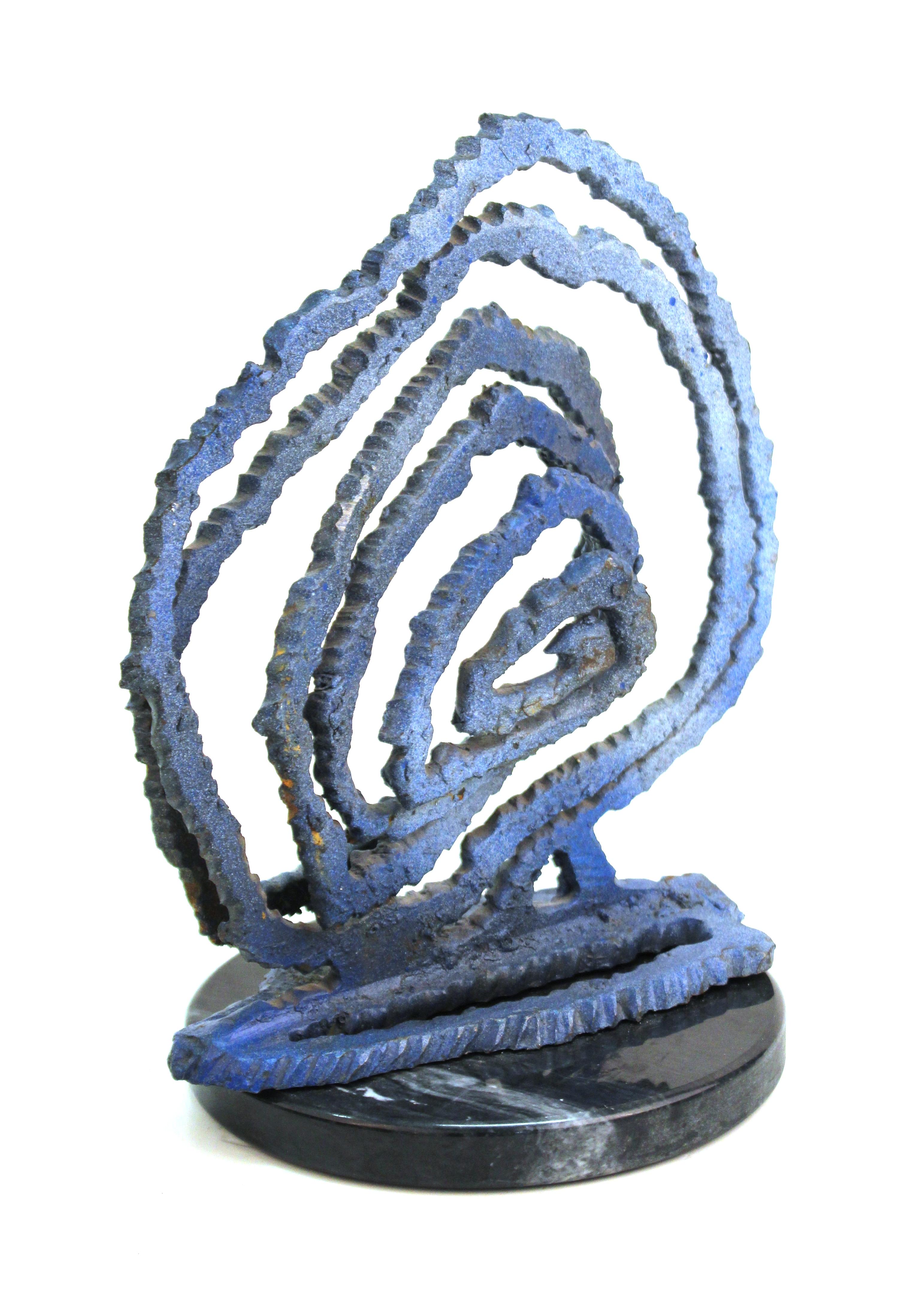 Brutalist modern abstract tabletop sculpture depicting a cut metal spiral atop a marble base. The piece is spray-painted in a blue finish and remains unsigned. In great vintage condition with age-appropriate wear.