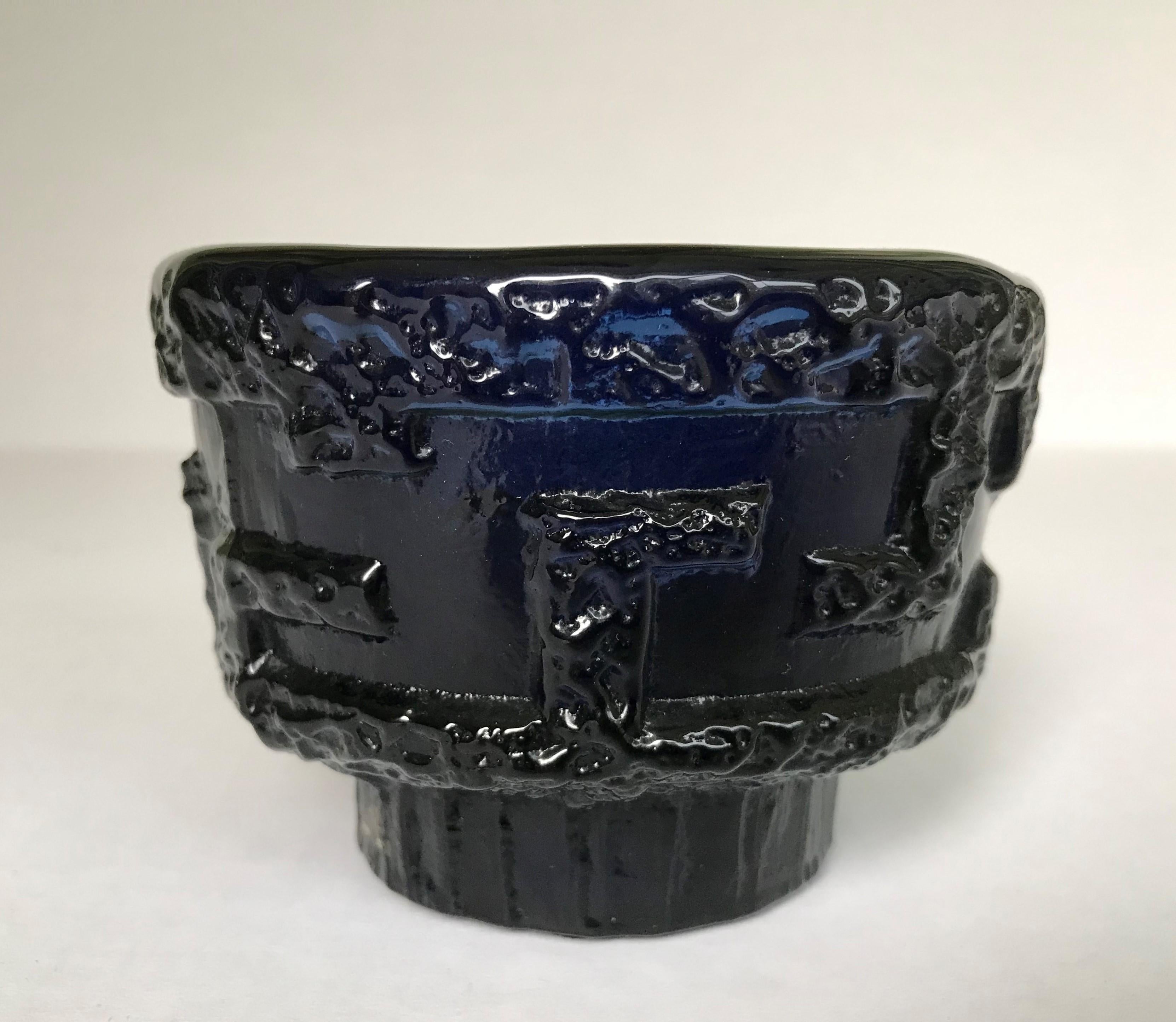 The Ruda Glasbruk company was founded in 1910 in Ruda, a town in the glass making area of Sweden, and closed in 1972. High levels of cobalt was used to give the glass its deep midnight blue color. The shape was given when poured into molds made from