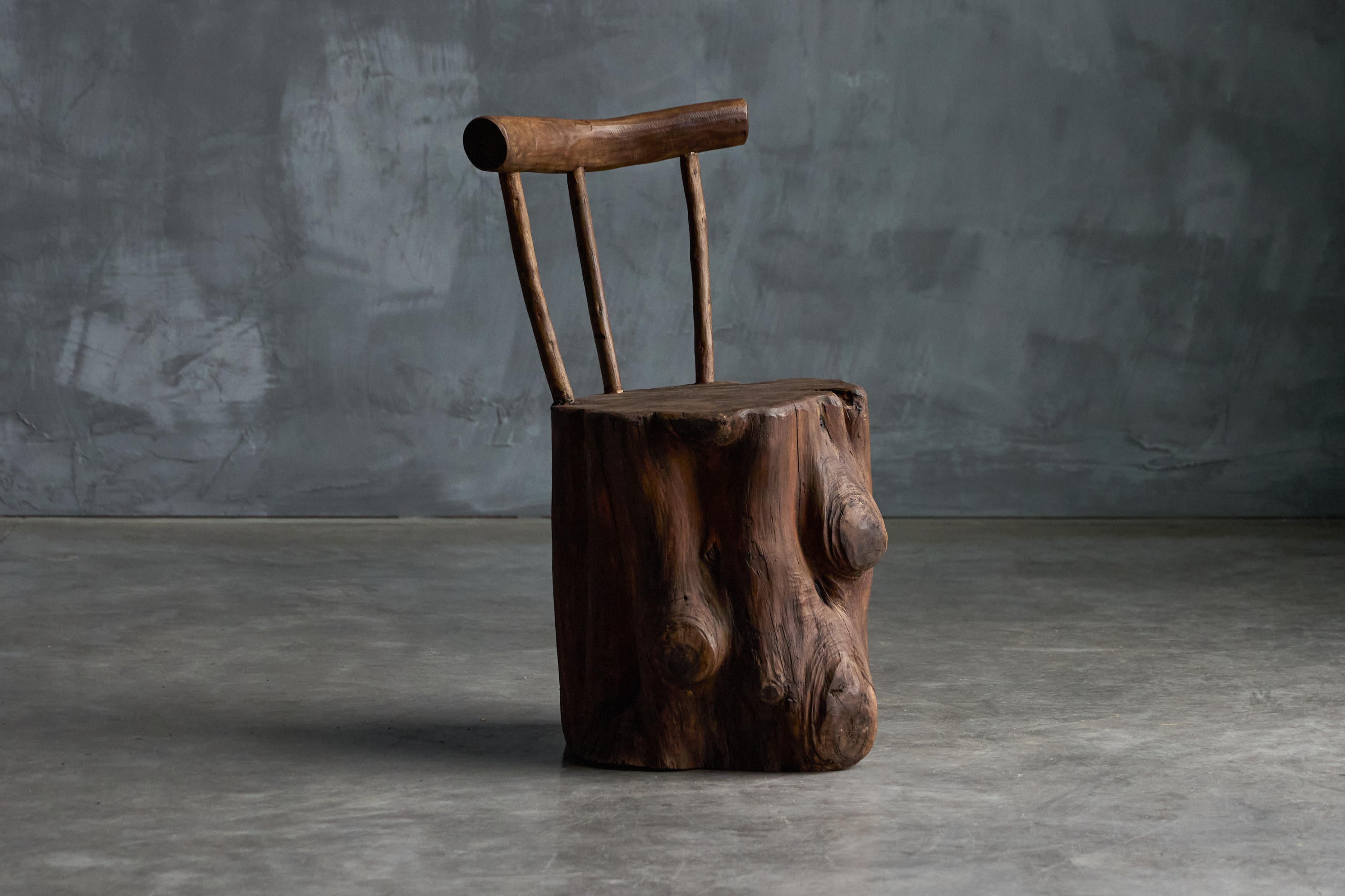 This handcrafted brutalist chair, dating back to circa 1970, showcases the raw beauty of solid wood with its bold design. A true statement piece, it reflects the unique artisanal craftsmanship of the era. The chair’s sturdy construction and striking