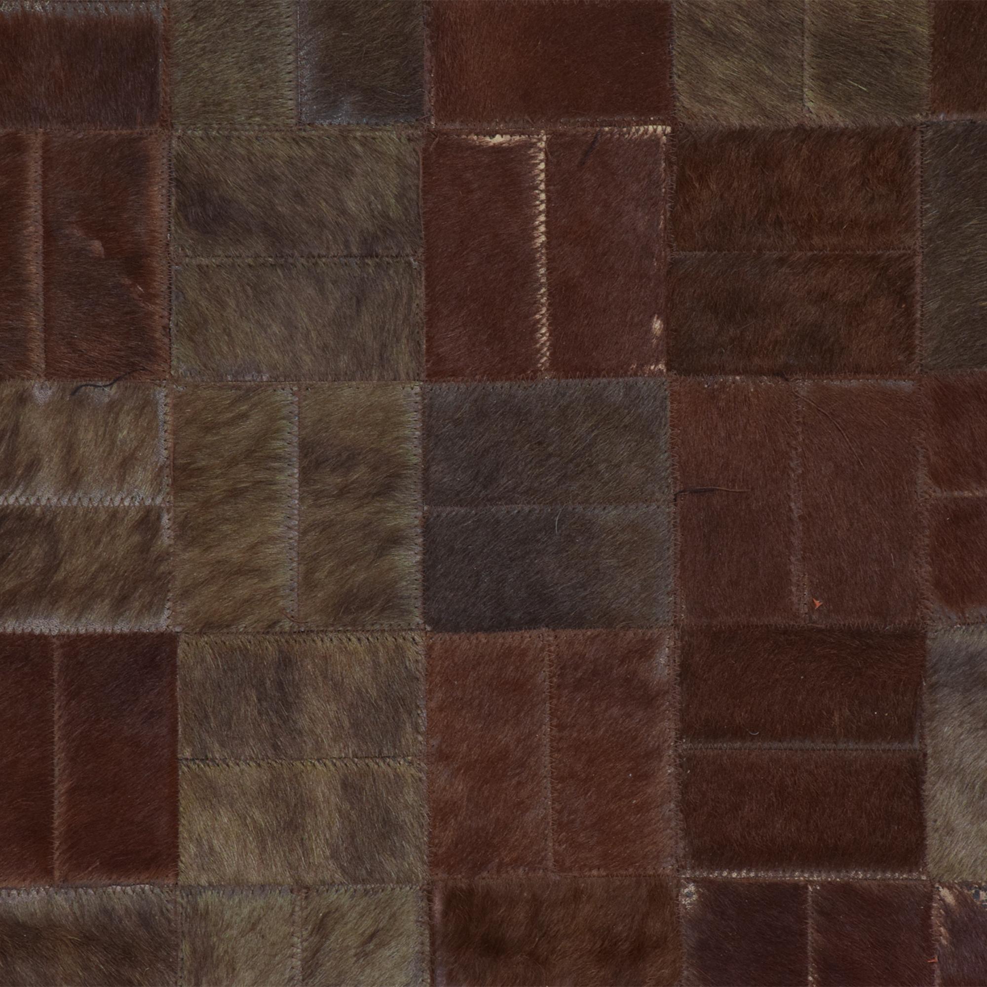 Mid-Century Modern brutalist era mosaic square pattern patchwork cowhide brown leather rug.
Mosaic patchwork of square patterns of cowhide in varied warm tones.
Unmarked. In the style of Paul Evans Brutalism.
Dimensions: 99 x 158 inches
Original