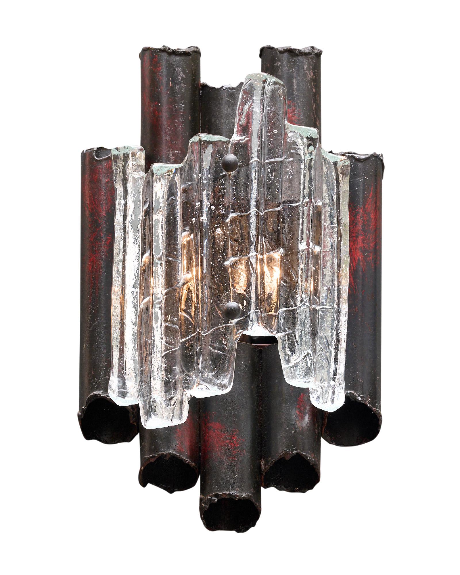 Pair of sconces made of metal and Murano glass. The metal structures feature tubed metal covered with Murano glass elements. We love the brutalist details of this pair. They have been newly wired to fit US standards.
