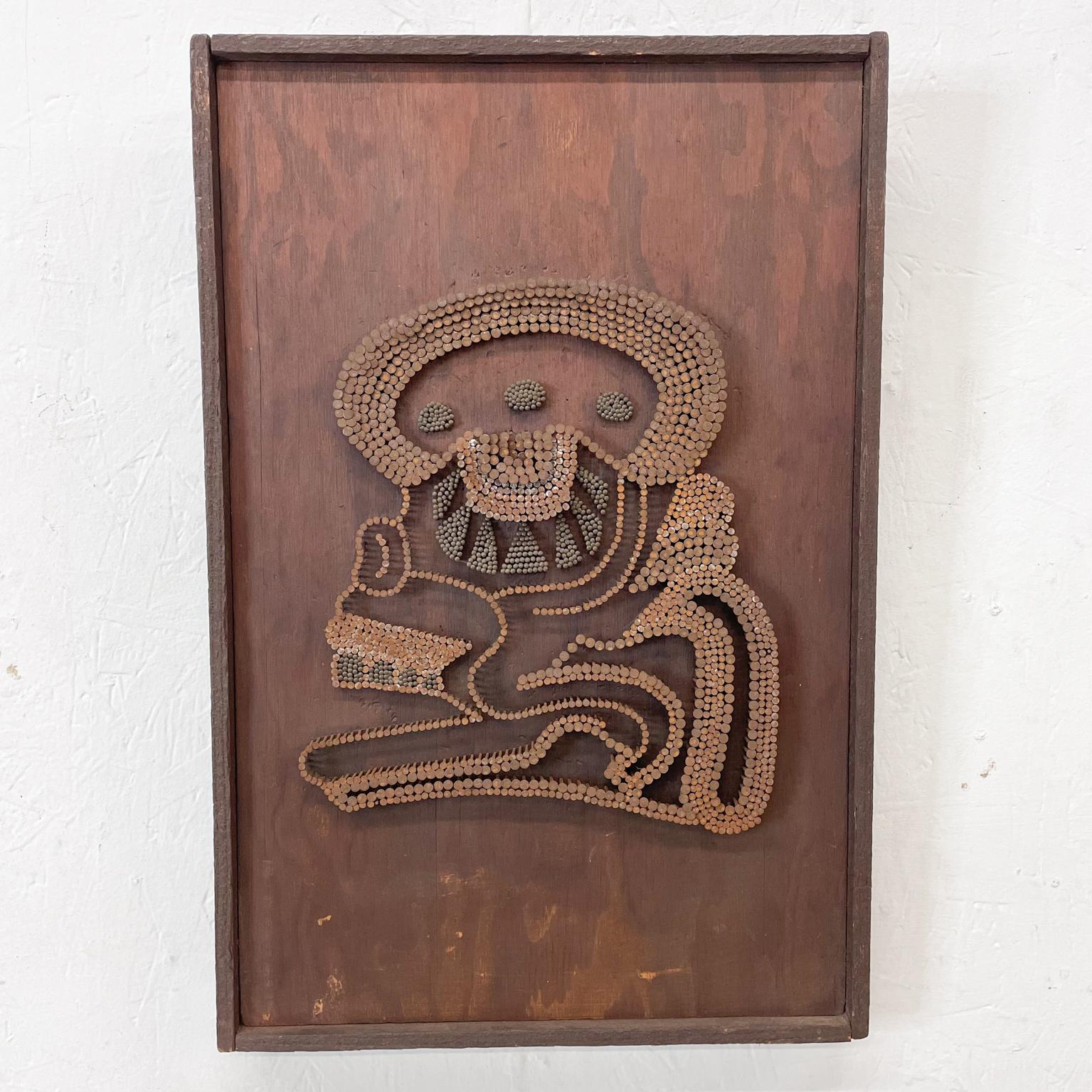 Brutalist wood art piece with nails in an abstract Mayan design.
No signature.
Measures: 18.75 H x 12/38 W x 1.5 Thick inches
Original vintage unrestored condition.
Refer to images.
  