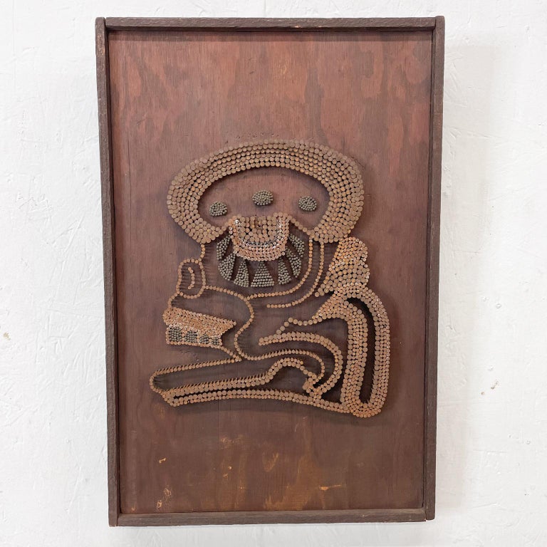 Brutalist wood art piece with nails in an abstract Mayan design.
No signature.
Measures: 18.75 H x 12/38 W x 1.5 Thick inches
Original vintage unrestored condition.
Refer to images.
  