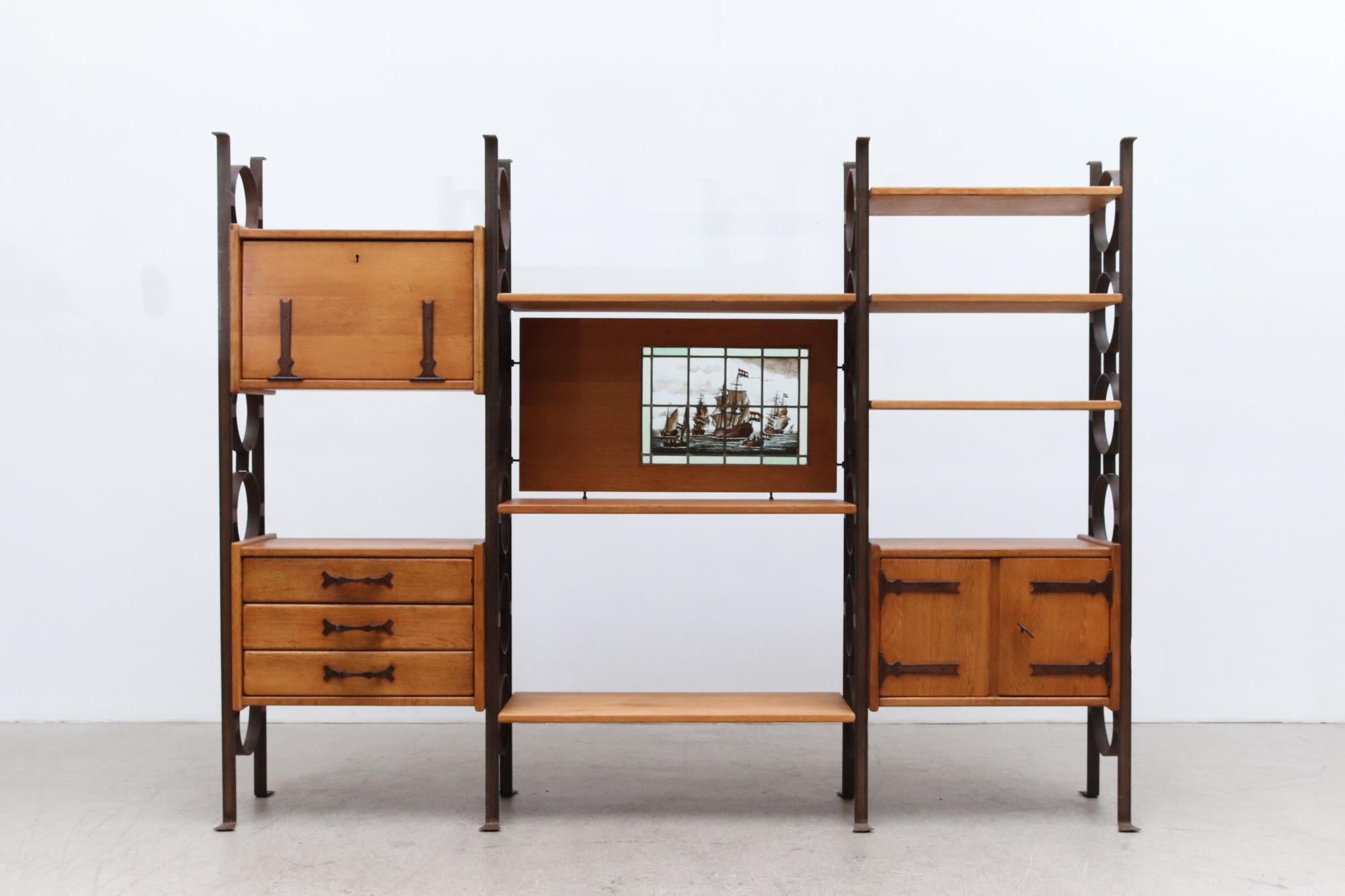 Stunning 3 section brutalist solid oak and iron room divider storage unit with adjustable shelves, cabinets, and panels. Middle section is 39.5