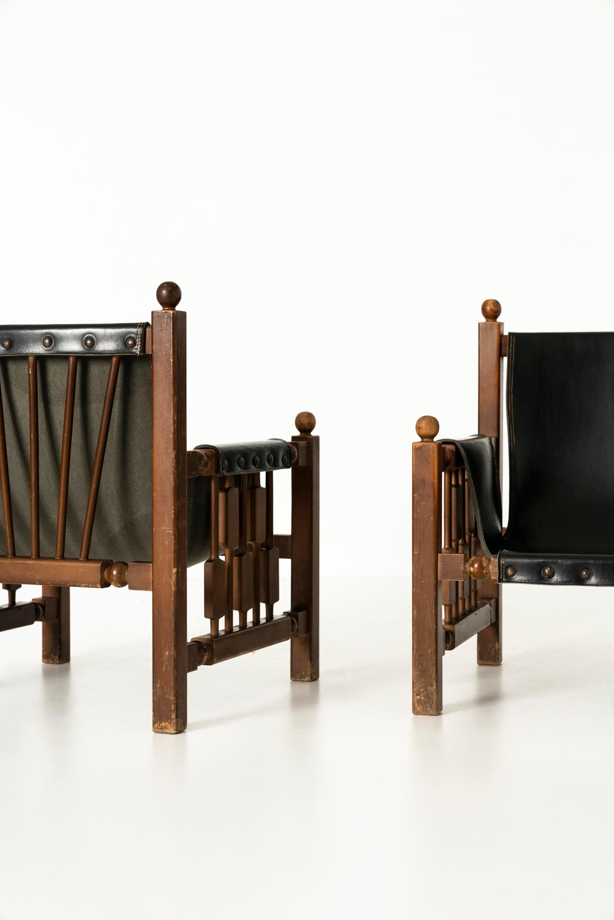 Mid-Century Modern Brutalist Oak Chairs with Faux Leather in the Style of Charles Dudouyt, 1950s en vente