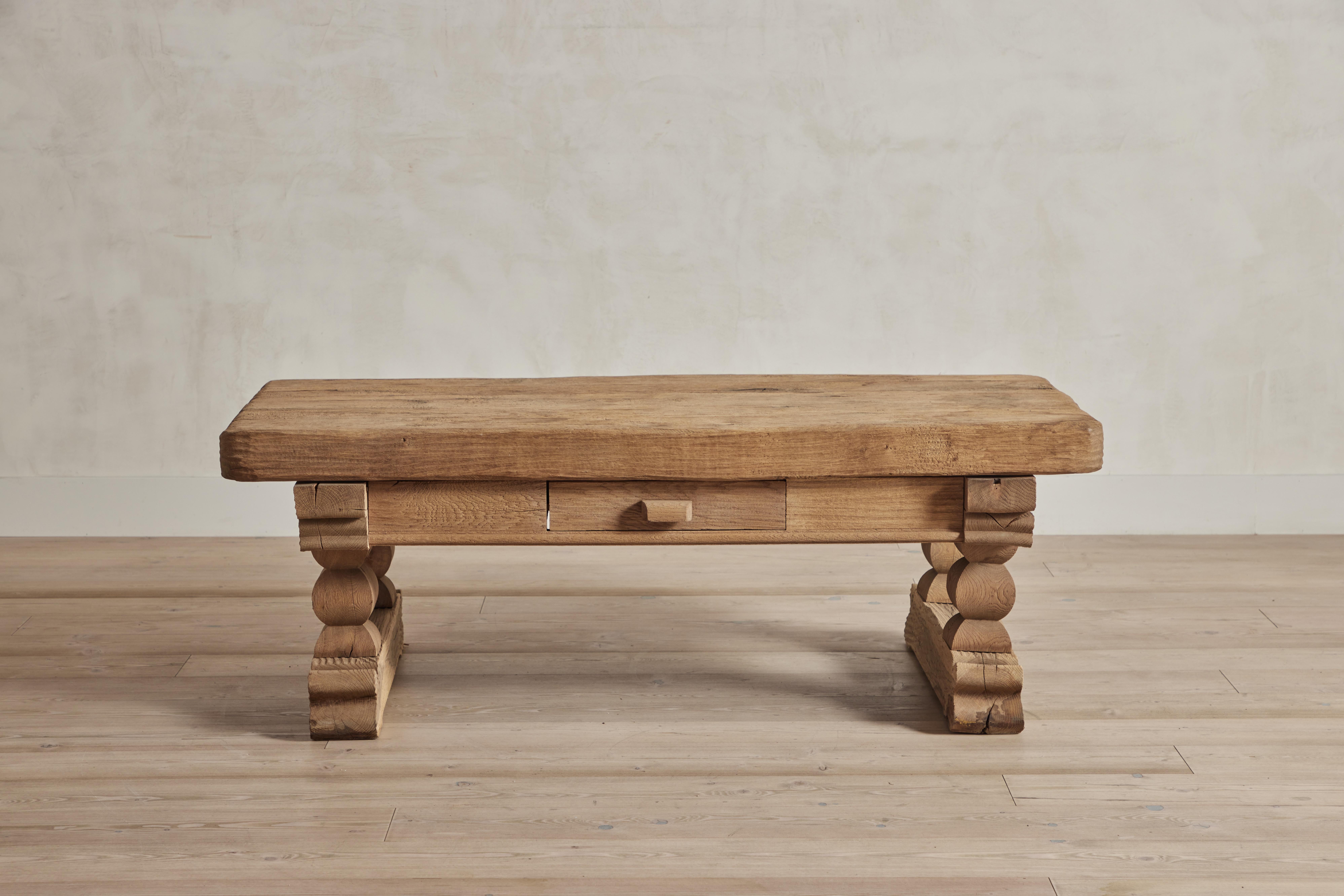 Rustic Brutalist wood coffee table from Denmark circa 1960. Wear throughout and some staining on wood that is consistent with age and use.