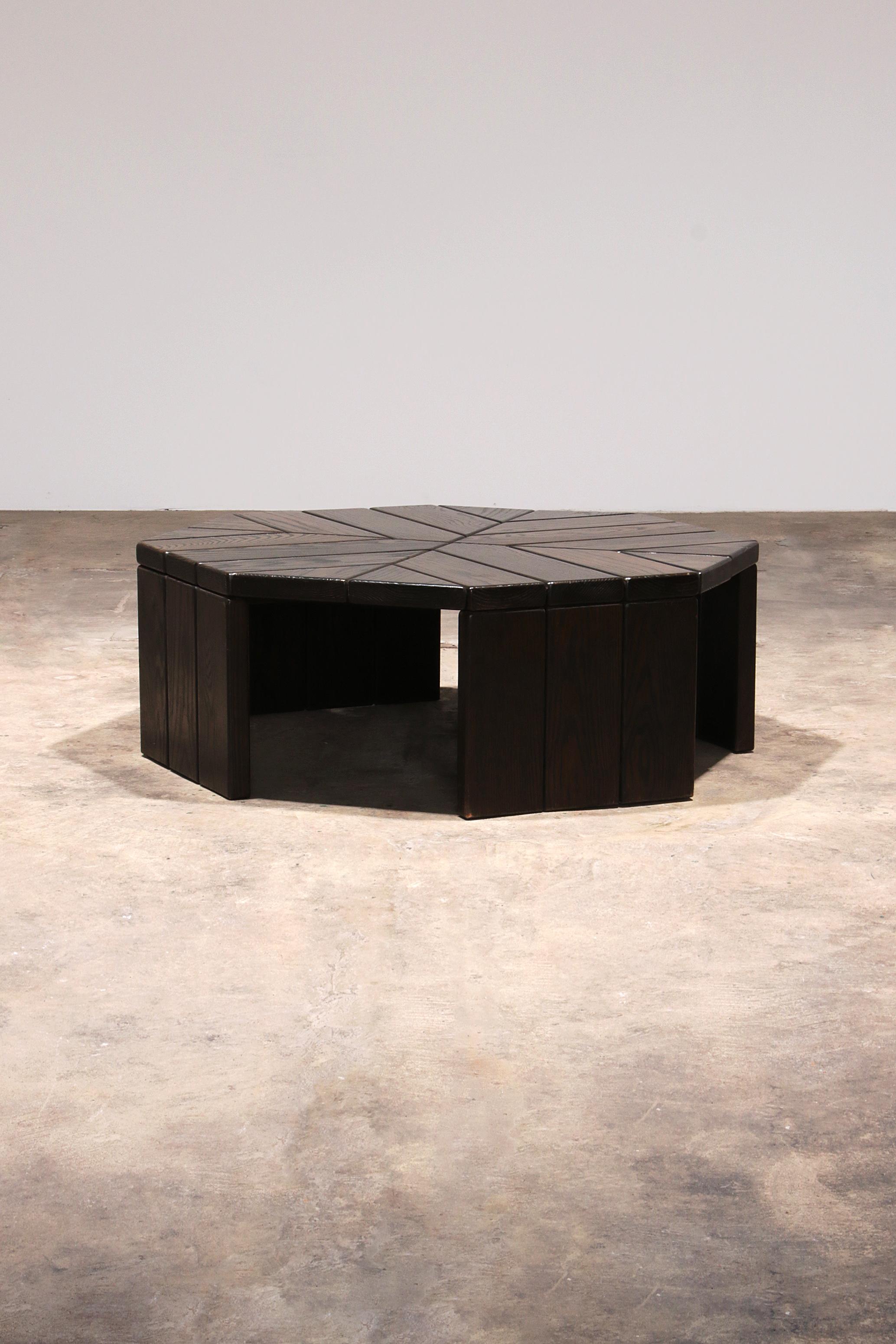 Discover the unique charm of our Brutalist Oak Coffee Table, a beautiful piece of craftsmanship from 1970. This octagonal coffee table, with its robust and striking design, is a real eye-catcher in any interior. Manufactured in Germany, this table
