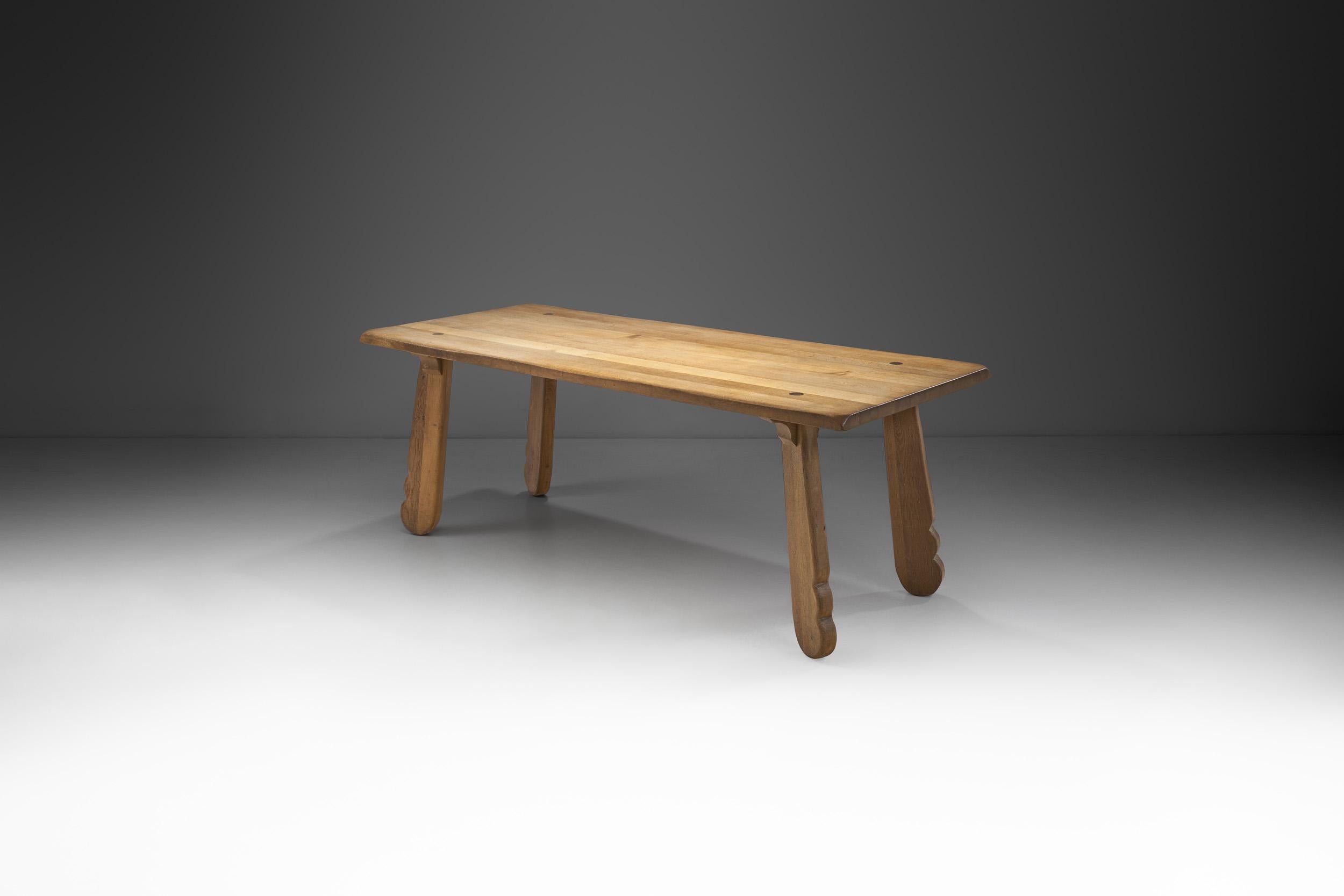 Technical ingenuity and mastery are indispensable and fuel each other to achieve equally sublime and atmospheric results in The Puydt furniture. This rare oak dining table is an exceptional piece that is just as stunning as it is hard to come