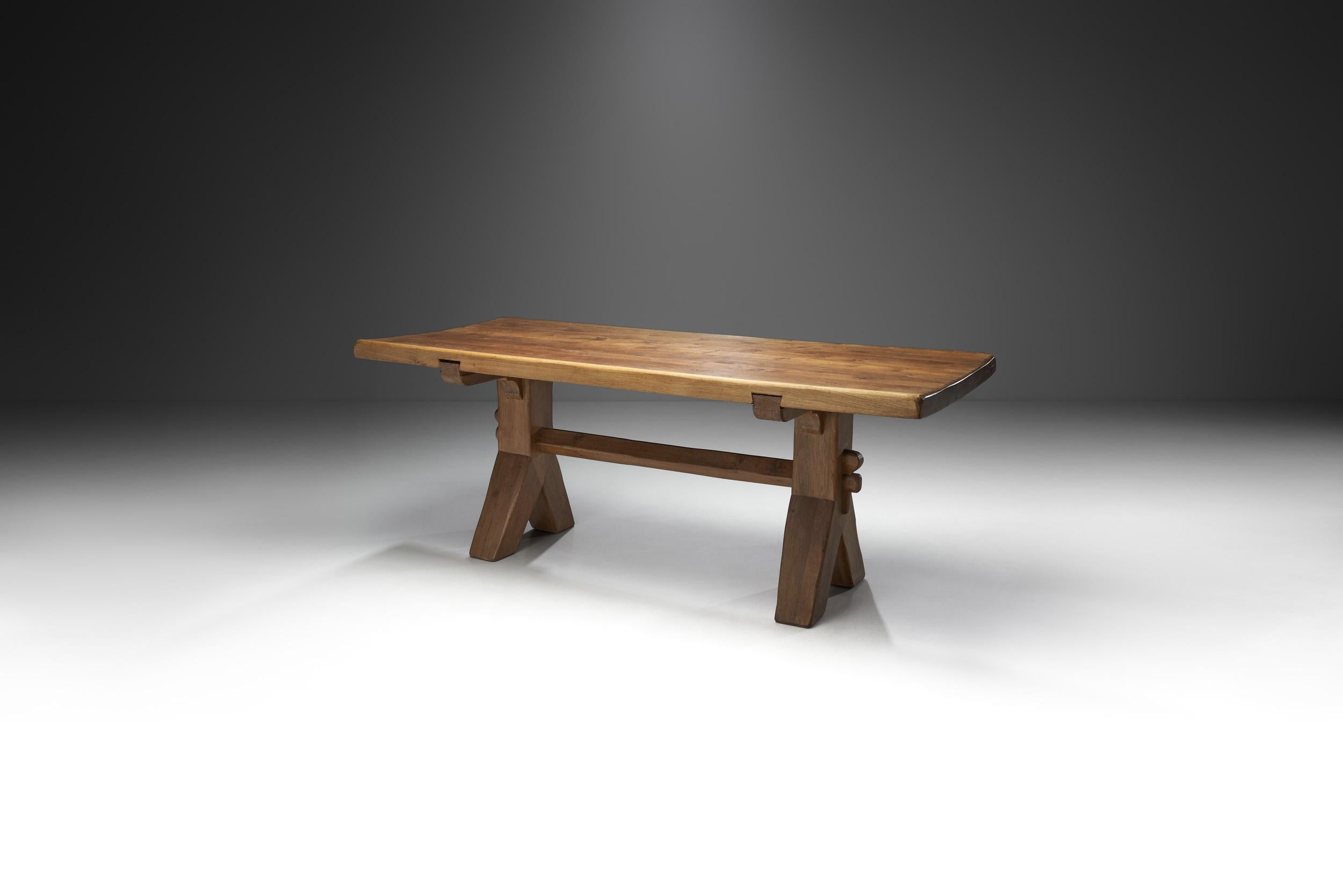Technical ingenuity and mastery are indispensable and fuel each other to achieve equally sublime and atmospheric results in The Puydt furniture. This rare oak dining table is an exceptional piece that is just as stunning as it is hard to come