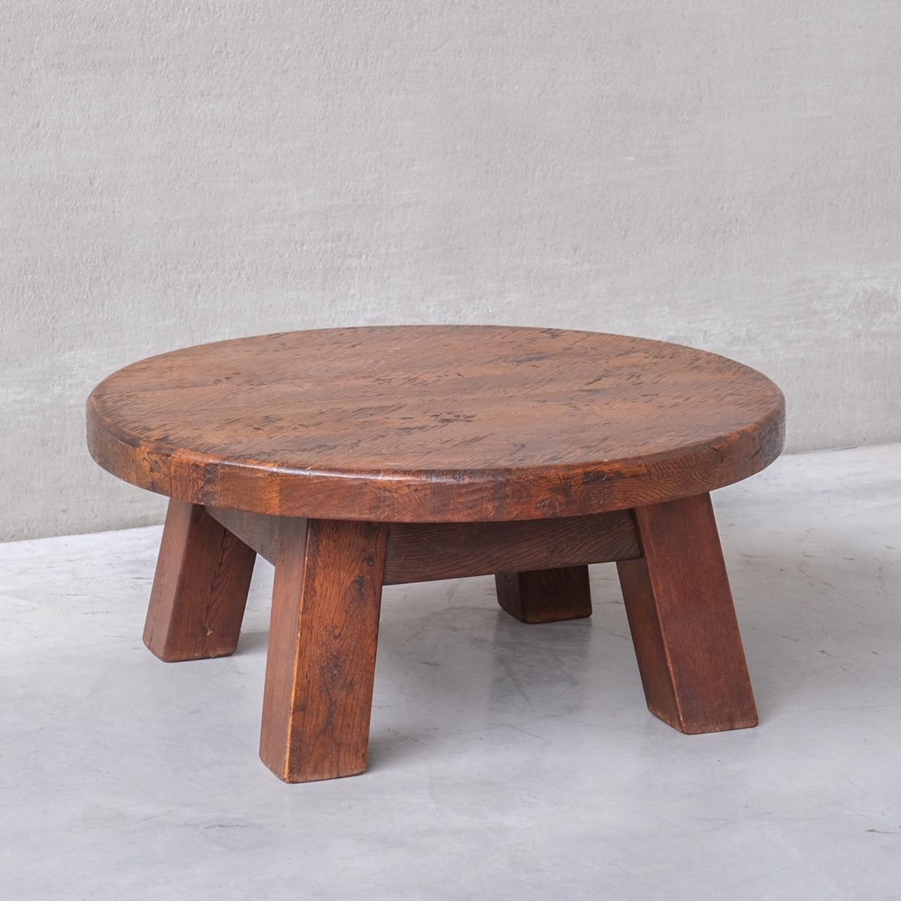 A Brutalist oak coffee table.

Holland, circa 1970s.

Primitive chunky construction.

Good condition.

Internal Reference: 284/CT001

Location: Belgium Gallery.

Dimensions: 98 Diameter x 44 height in cm.