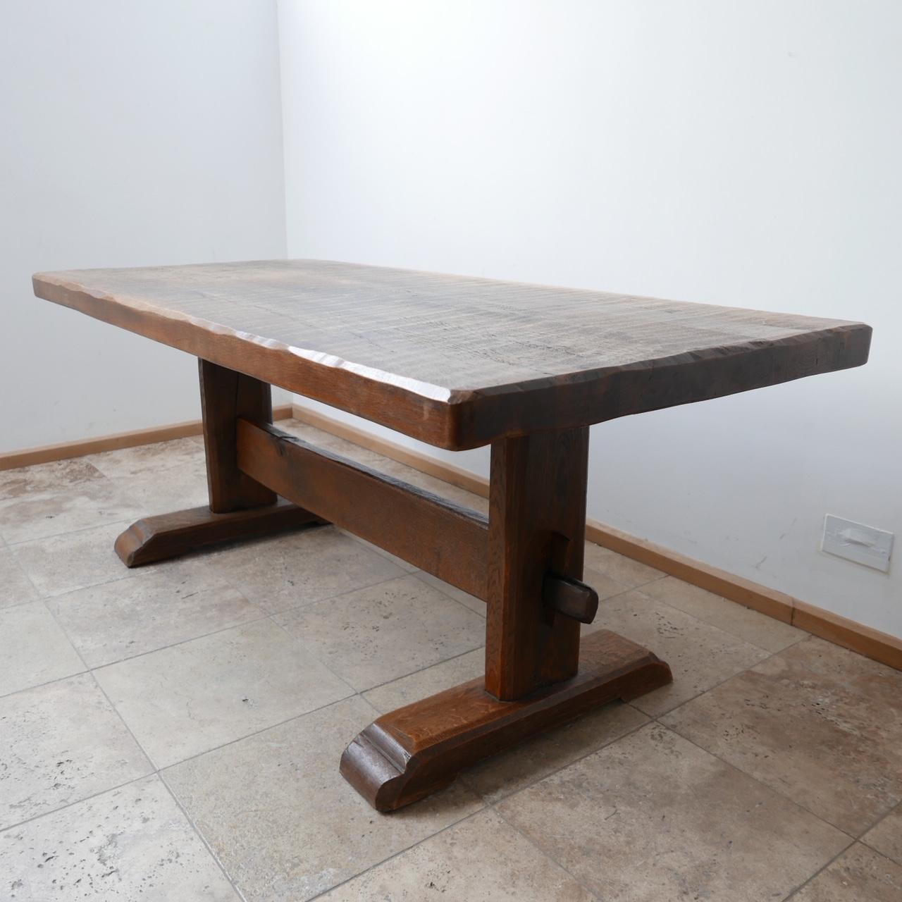 A thick topped brutalist dining table. 

Gently adzed top. Lovely rustic appeal. 

Holland, c1970s.

Knocks down for transport. 

Some age related wear but generally good condition. 

Location: London Gallery. 

Dimensions: 188 W x 86 D x 74 Total