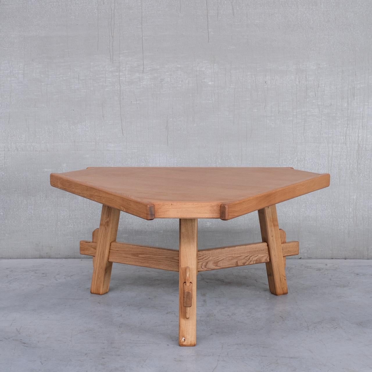A brutalist style mid-century dining table. 

Spain, c1970s. 

Solid and veneered oak. 

Fully restored. 

Plenty of character with exposed peg joints. 

Location: Belgium Gallery. 

Dimensions: 74 H x 135 W x 135 D in cm. 

Delivery:
