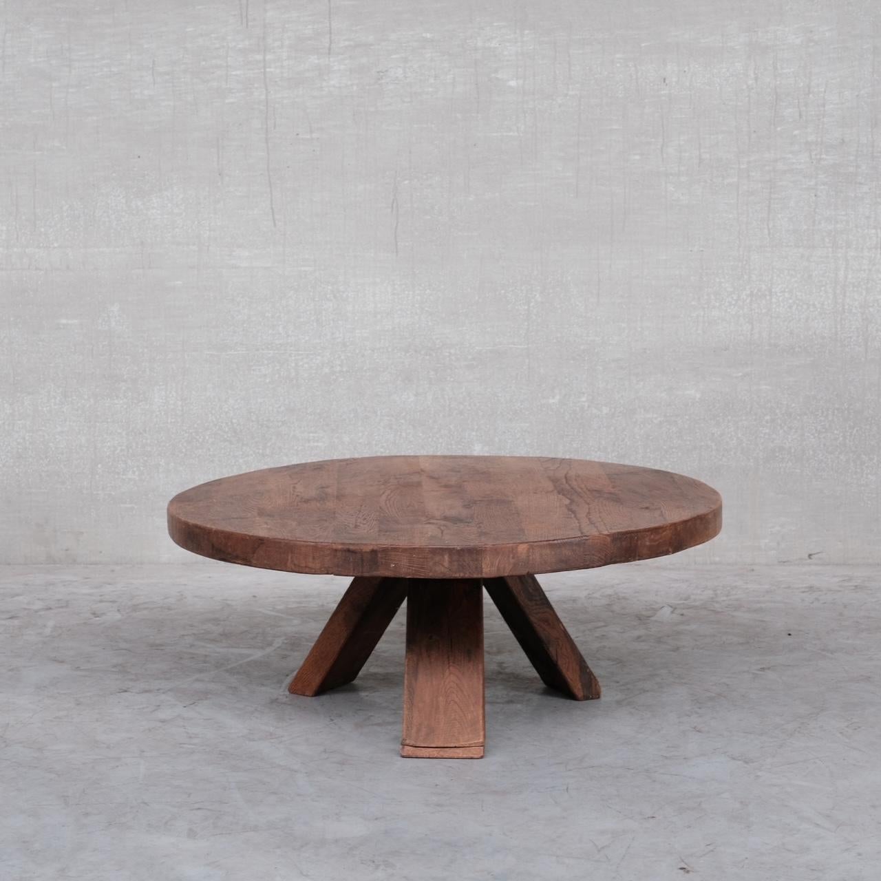 A brutalist oak coffee table. 

Holland, c1970s. 

Solid oak, raised over tripod legs. 

Good condiition generally but some wear to the top commensurate with age. Could be stripped and re-waxed upon request if one prefers a new look.
