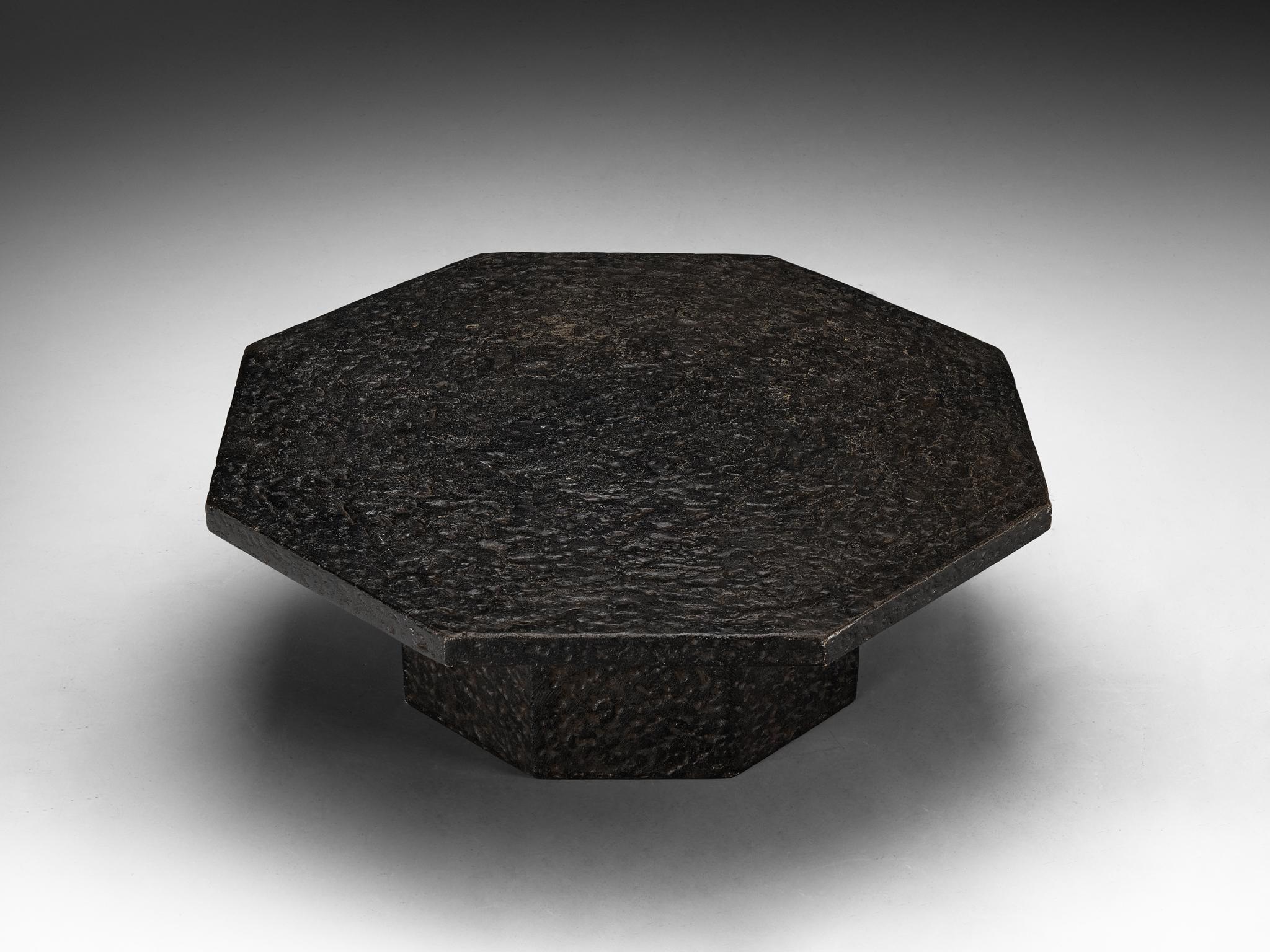 Cocktail table, resin, Northern-Europe, 1970s.

This deep black robust coffee or cocktail table is from the 1970s. The thick octagonal shaped top is supported by a smaller column. The whole construction is executed in resin which resembles the