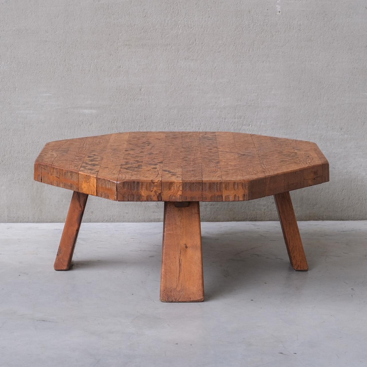 An oak coffee table in octagonal shape. 

Holland, circa 1970s.

Brutalist style. Thick chunky legs. 

Good condition.

Internal Reference: 284/CT010.

Location: Belgium Gallery. 

Dimensions: 110 Diameter x 45 H in cm. 

Delivery: