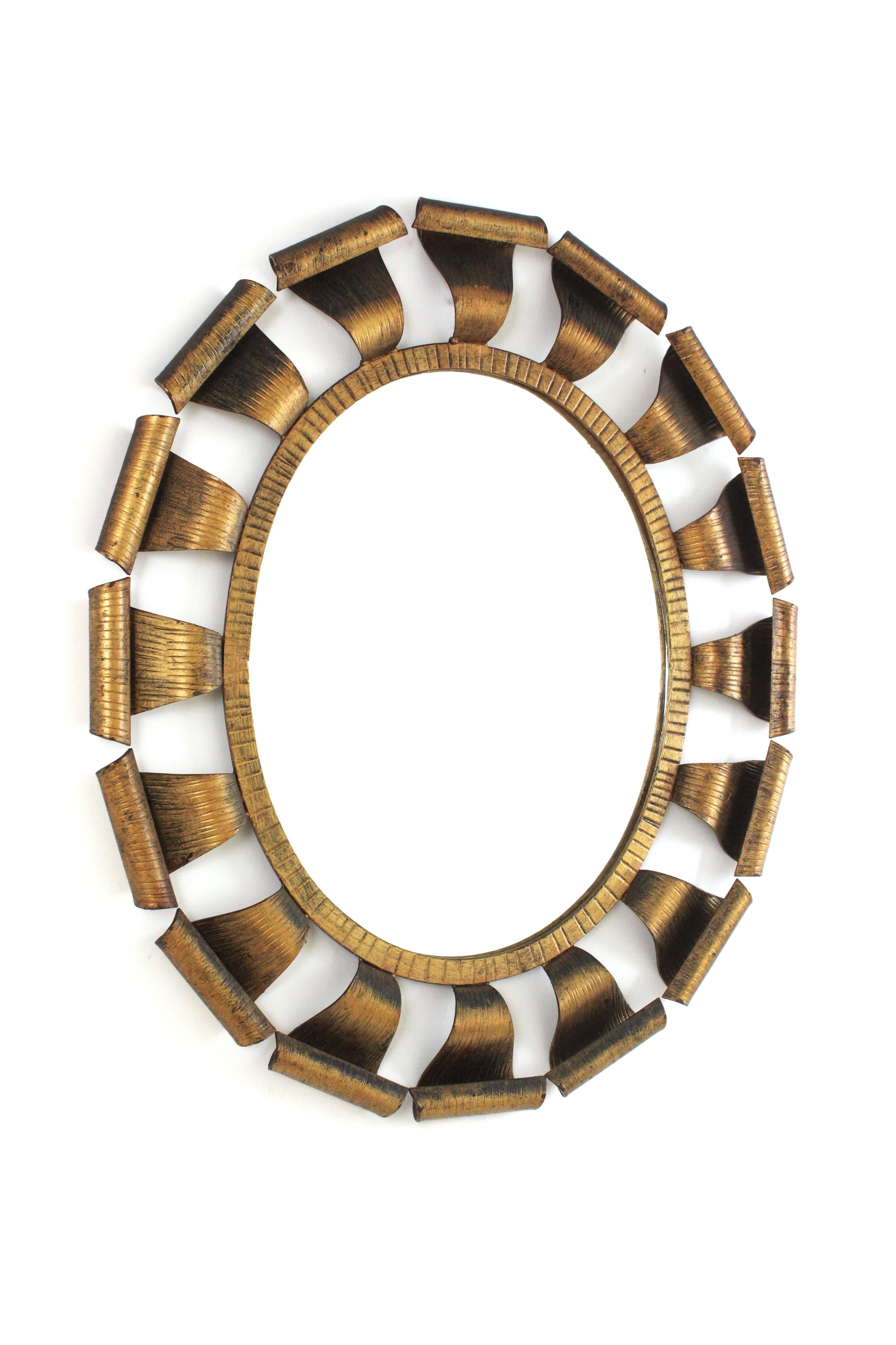 Gilt Oval Eyelash Mirror in Wrought Iron
Wrought Iron Oval Sunburst Mirror with Scroll Ended Rays and Brutalist Design, France, 1950-1960.
Eye-catching hand forged sunburst iron mirror with scrolled rays and oval shape.
This beautiful oval mirror