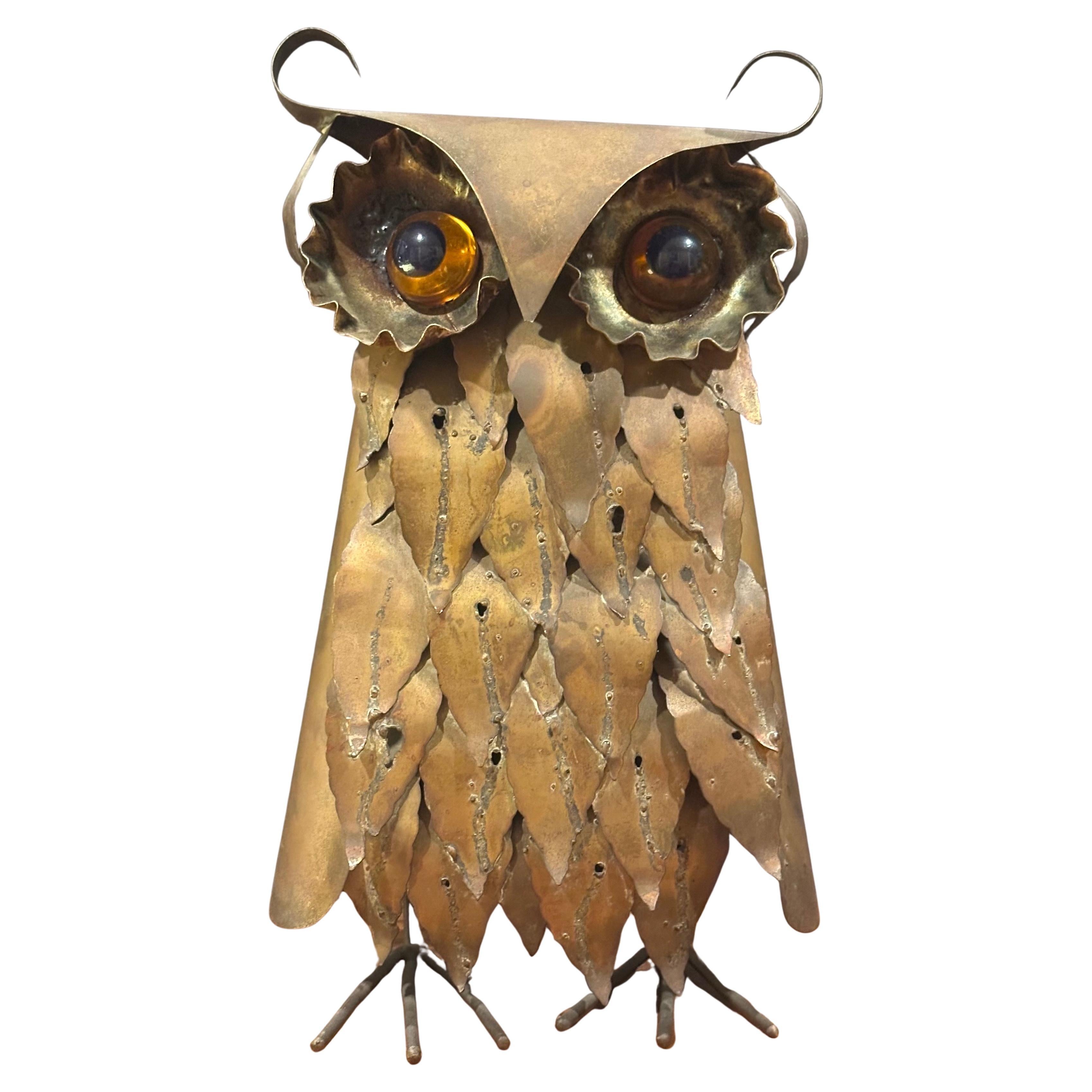 A really cool brutalist owl sculpture in raw metal with glass eyes in the style of Curtis Jere, circa 1960s.  The sculpture is in very good vintage condition and measures 7