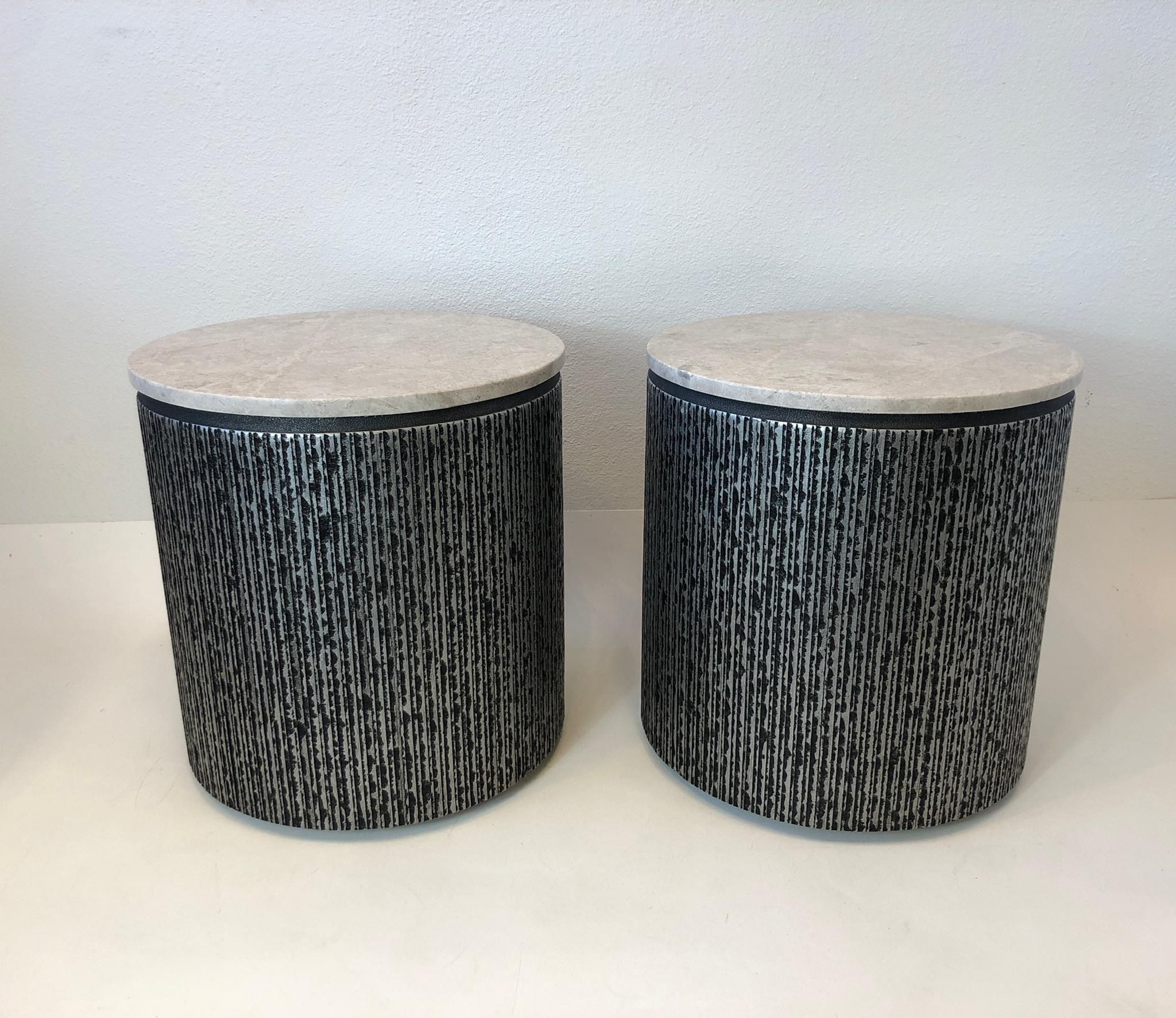 1970’s Brutalist pair of drum side tables designed by Form and Surfaces for Steve Chase. 
This came out of a Steve Chase estate in Palm Desert CA. 
The tops can be remove for storage. 
Constructed of fiberglass with a silver and black finish and