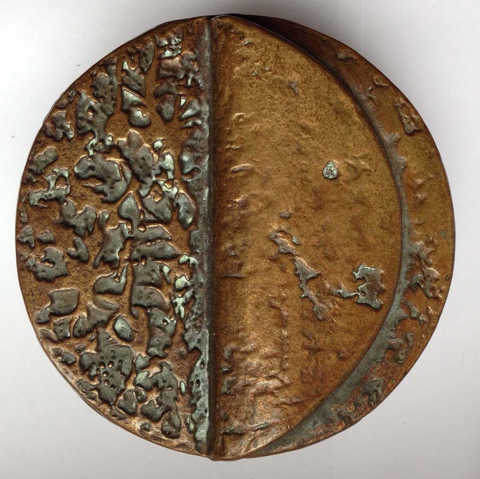 1970's Bronze cast pair of round push and pull door handles with relief that looks like a folded page. The original patina adds to the depth of the relief. The identical handles can be used on pair of double doors or opposite sides of the same door.