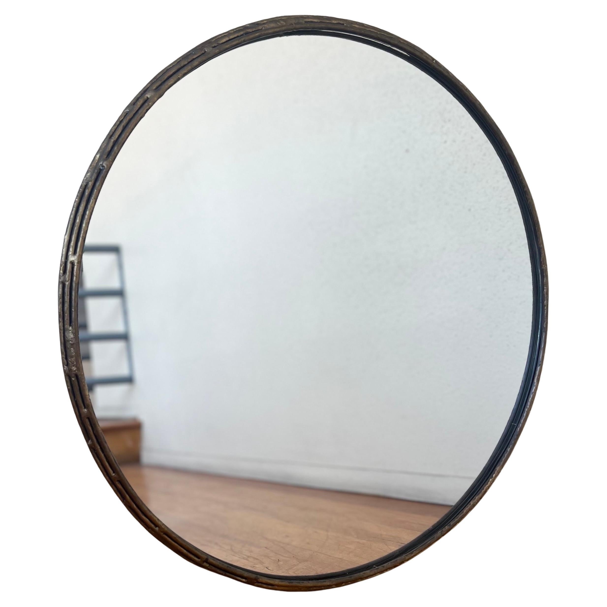 Patinated verdigris finish round mirror nice clean condition simple elegant design.