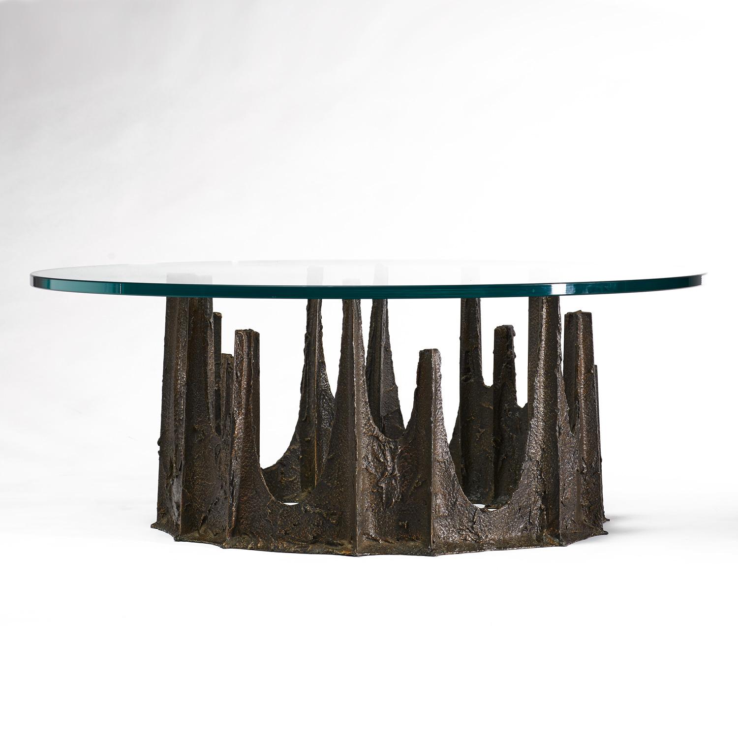 Outstanding vintage coffee table by celebrated American designer, Paul Evans. Signed and dated (1973) the sculpted metal table resembles a stalagmite. Evans expertise in metallurgy is evident as he transformed the typical aesthetic of the metal in