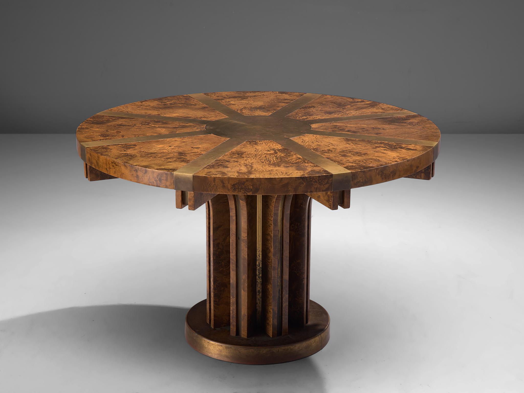 Brutalist pedestal table in burl wood and brass, Italy, 1950s

This sturdy pedestal table shows a pattern in eight repetitive elements, featured in the table top, construction and base. Clearly crafted by a true expert, showing nice craftsmanship