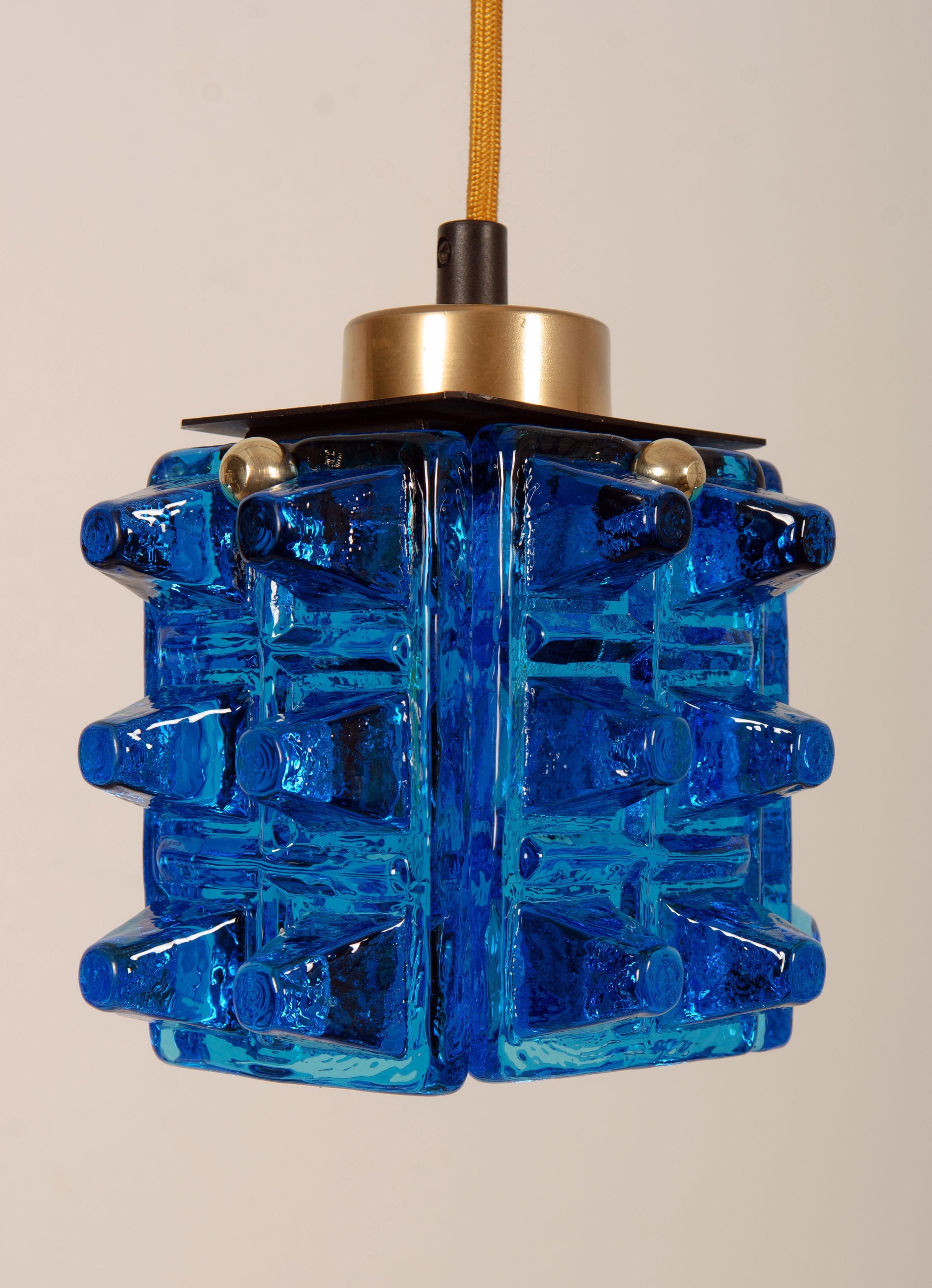 Painted steel frame fitted with one E14 sockets up to 100watts, 4 blue art glass elements. Made in Sweden, Urshult by Ateljé Engberg in the early 1970s. Up to 3 pieces available price per lamp.