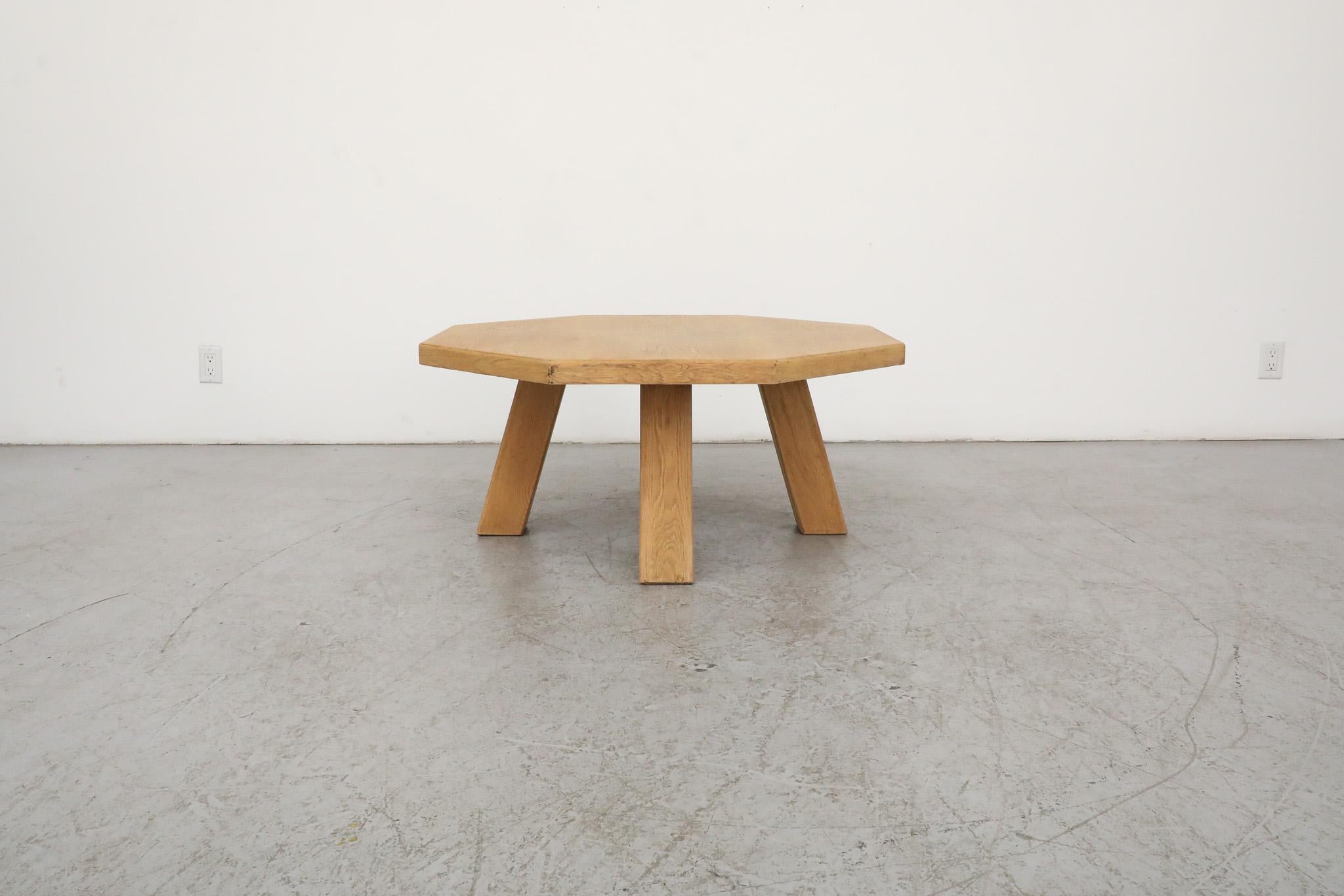 This stunning, Mid-Century, Pierre Chapo inspired light oak Brutalist side or coffee table has a striking, octagonal shaped top and chunky square legs. This piece has been lightly refinished, with some remaining wear that is consistent with the