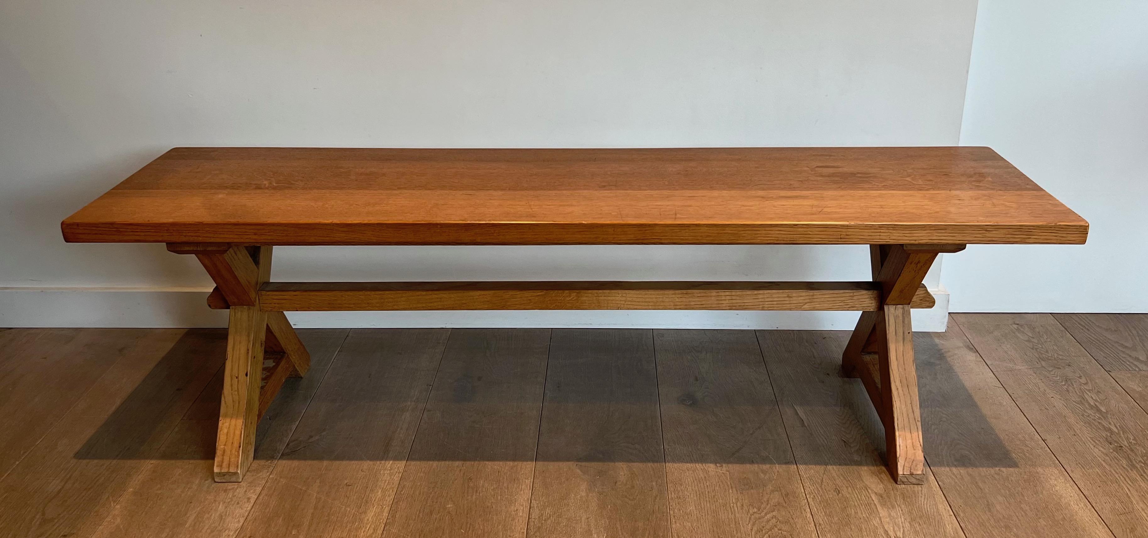 This nice and simple brutalist coffee table is made of pine. This is a French work. Circa 1950
