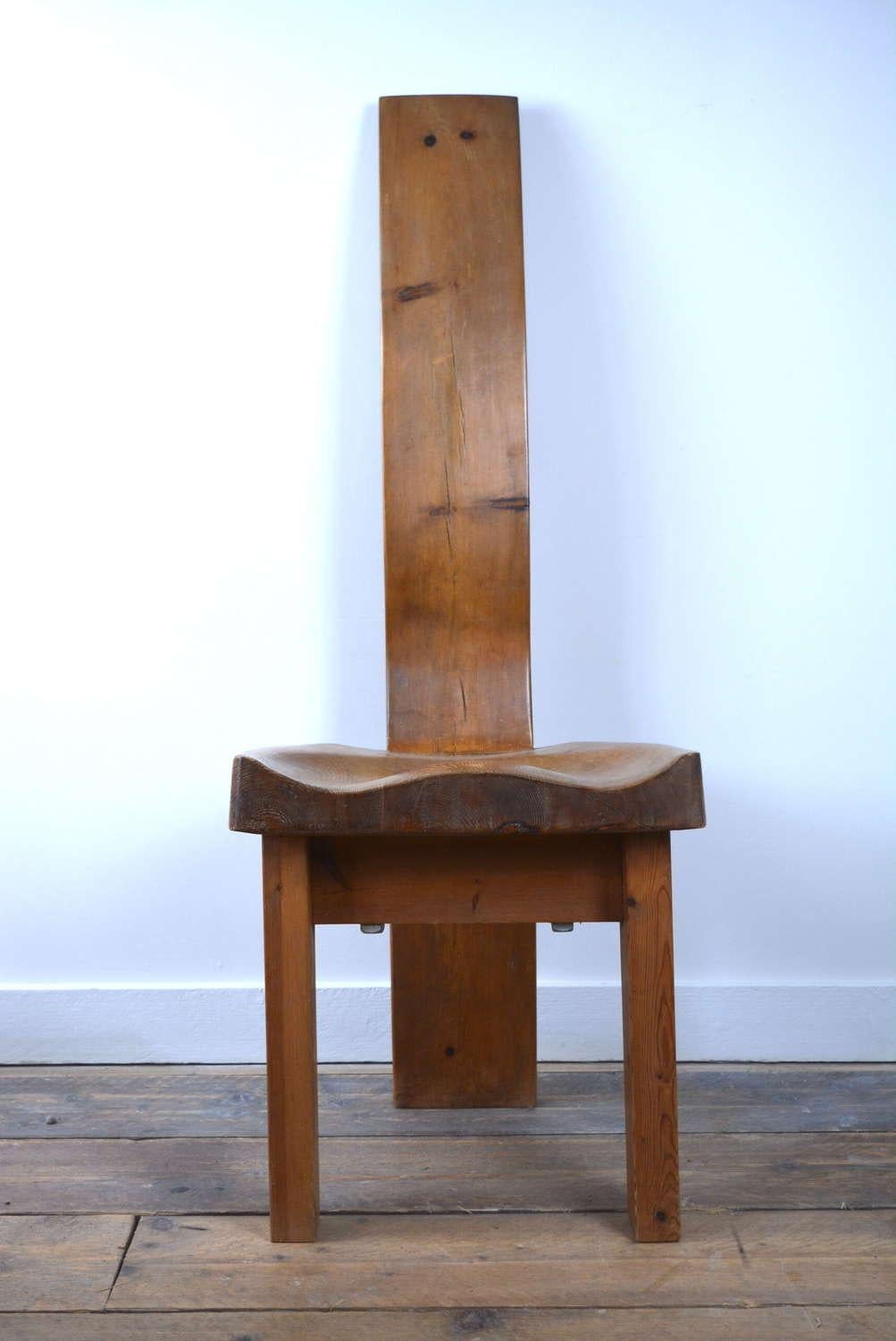 Brutalist pine wood chair with beautiful strong lines and softly curved seat. A striking mix of asceticism and comfort.

England, circa 1960

Dimensions: 17W x 47H x 18D.