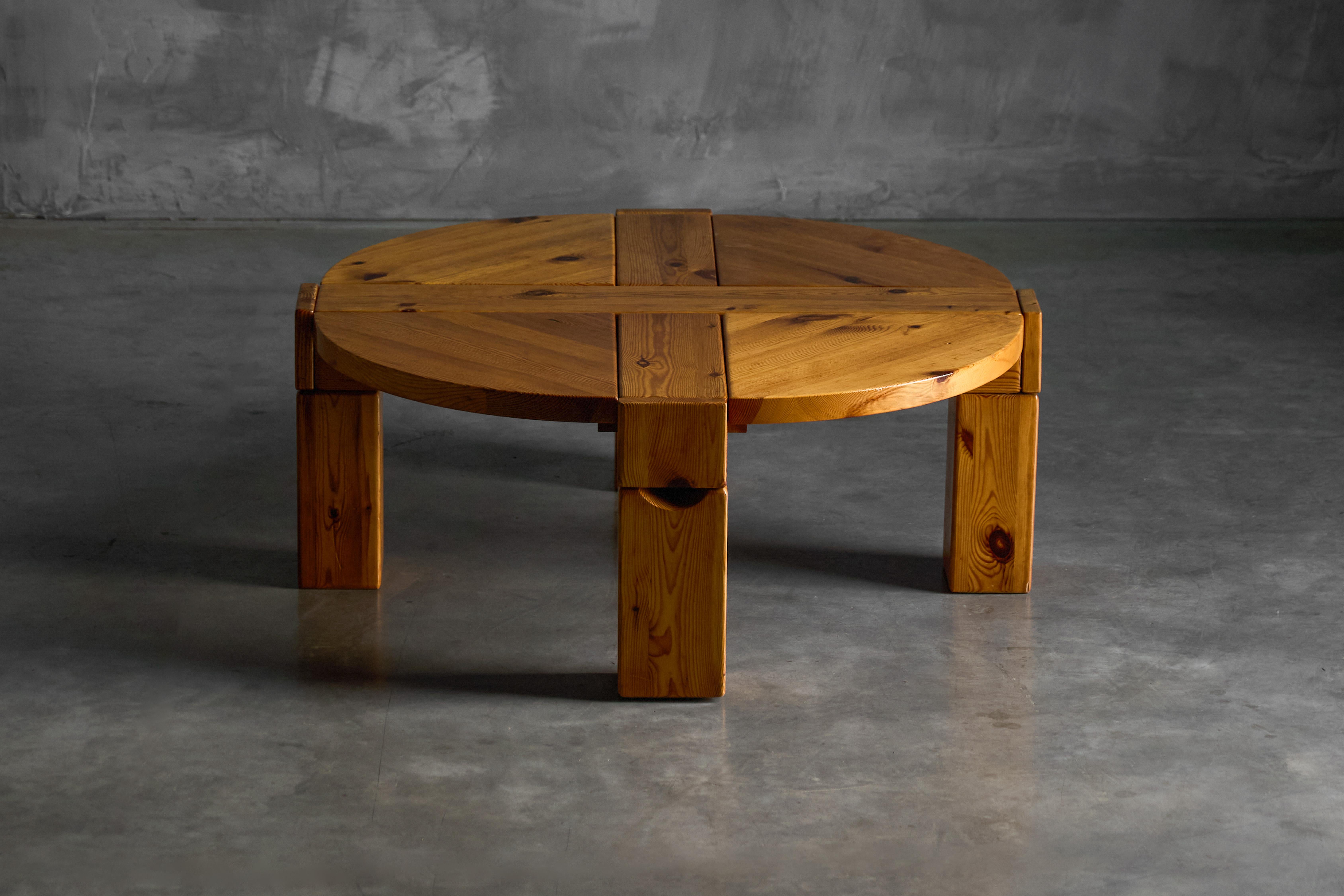A compelling example of brutalist design from 1970s Sweden, this solid pine coffee table exudes a raw, unapologetic material presence. Manufactured by Karl Andersson & Söner, the table is defined by its thick, circular top, boldly intersected by two
