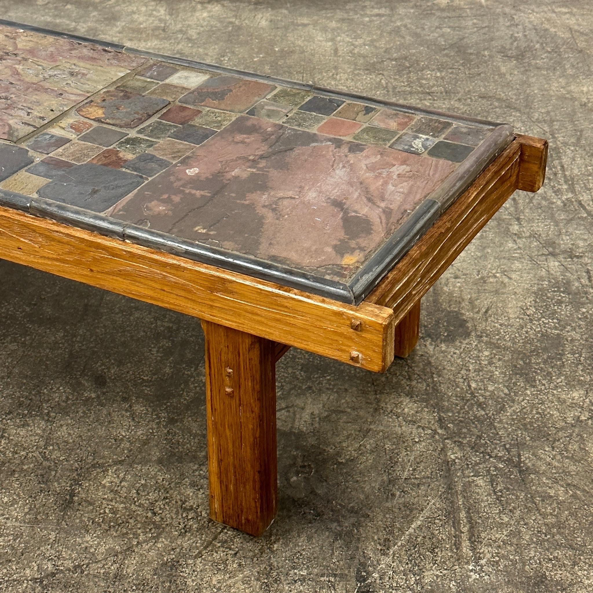 c. 20th Century. Mosaic stone slate top with wood frame. Reminiscent of Scandinavian tables. 