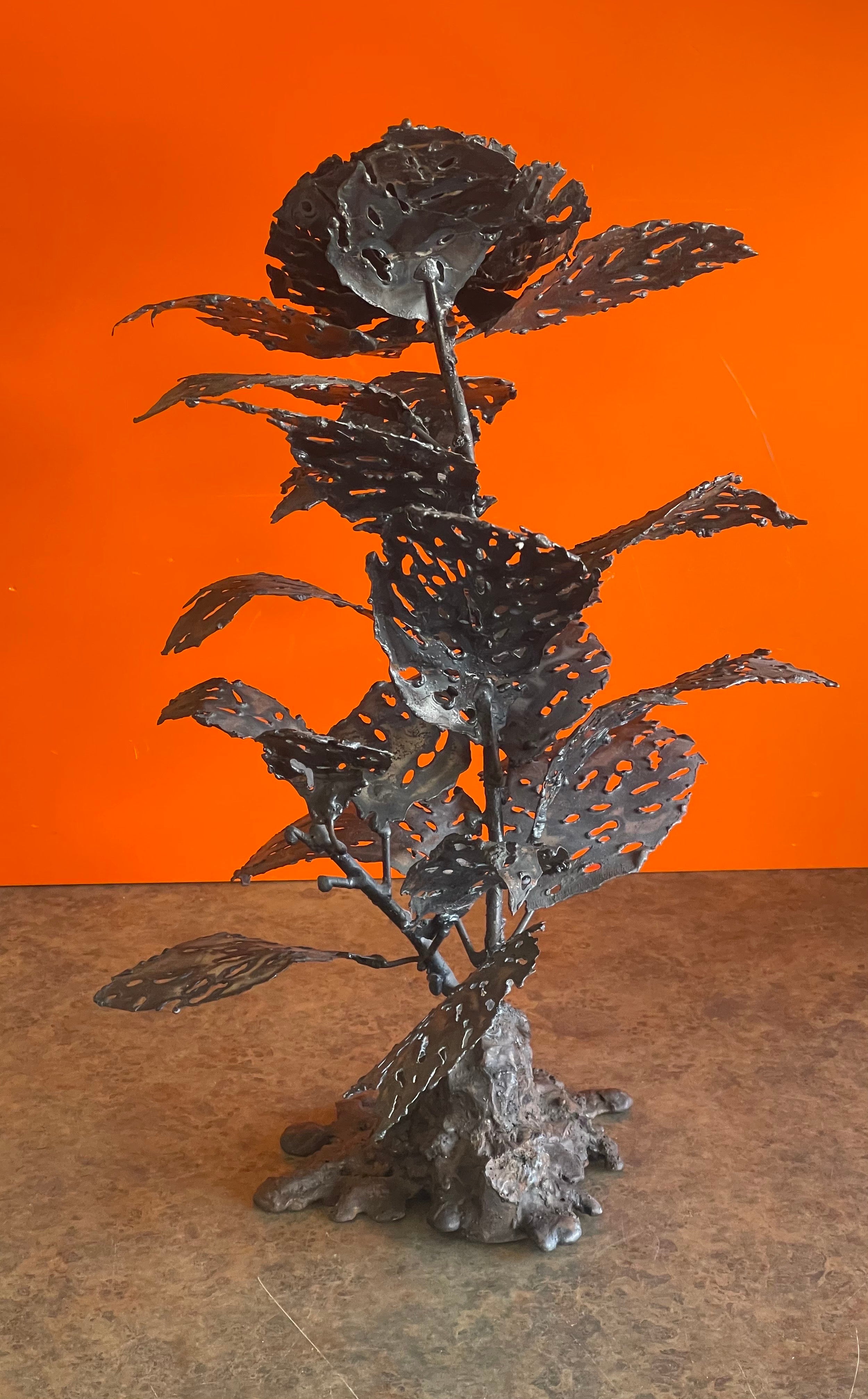 Brutalist raw metal torch cut flower sculpture by Dan Jordan, circa 1983. The sculpture is in very good vintage condition and measures 12.5