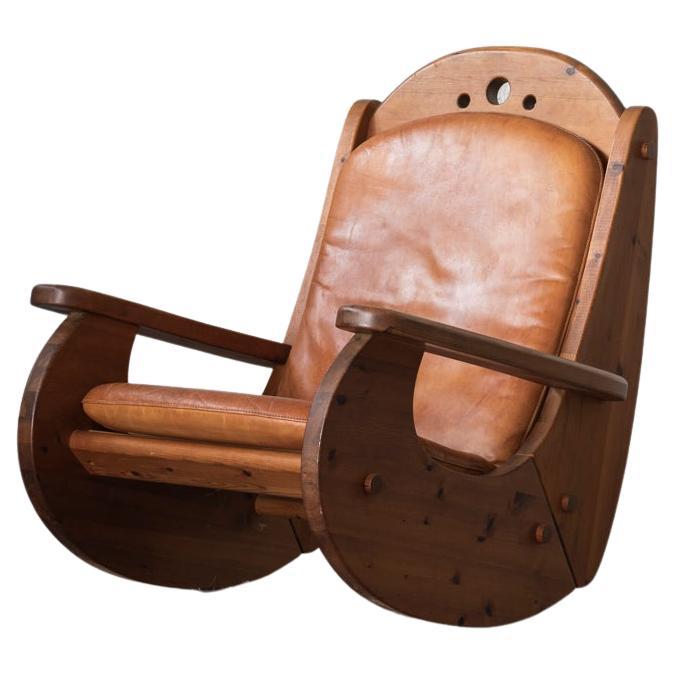 Brutalist rocking chair in pine wood and cognac leather, 1970’s