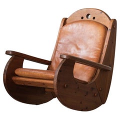 Brutalist rocking chair in pine wood and cognac leather, 1970’s